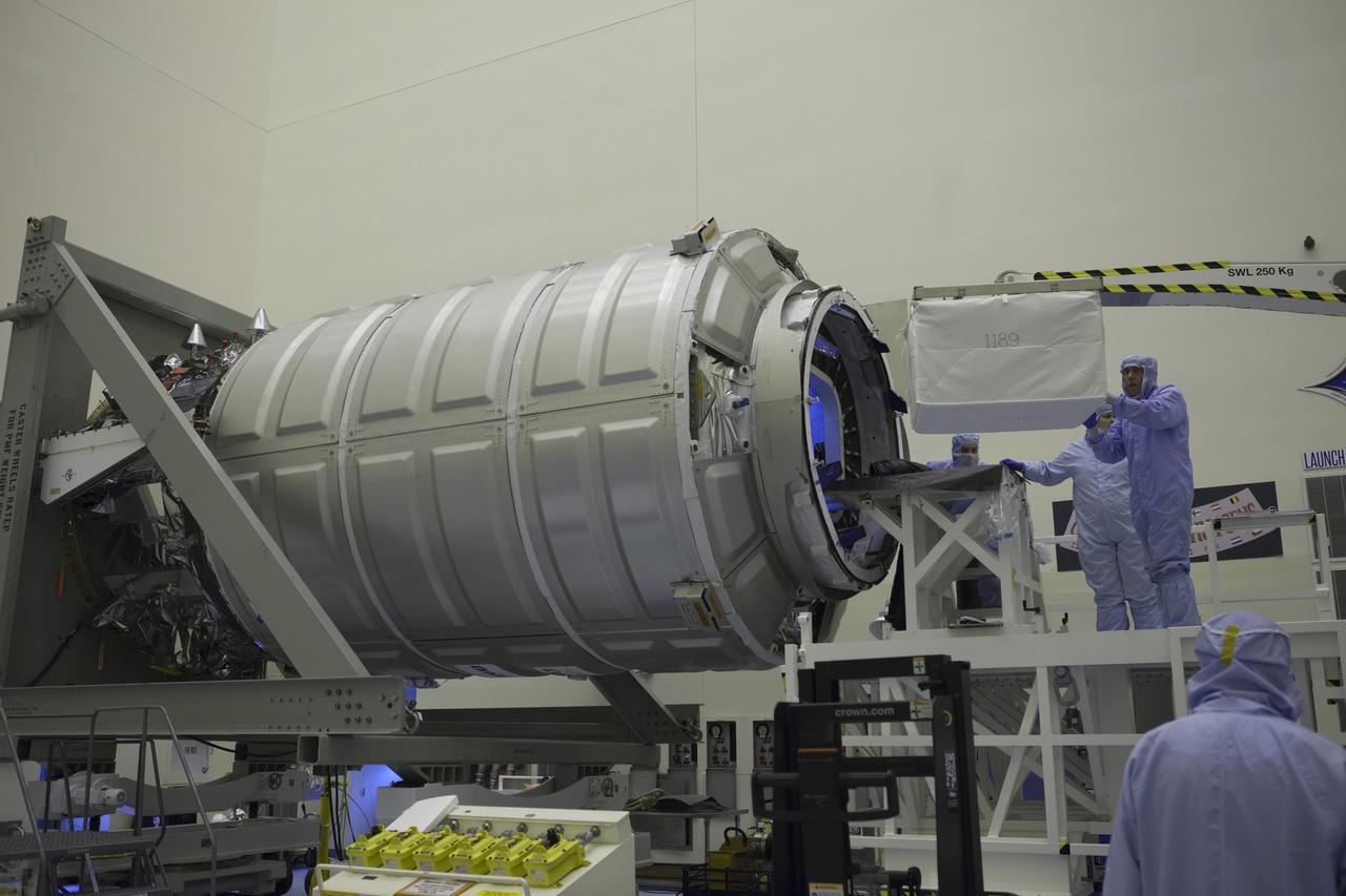 Technicians move cargo into the Orbital ATK CRS-6 pressurized cargo module during late stowage inside the Payload Hazardous Servicing Facility at NASA’s Kennedy Space Center in Florida. The spacecraft is scheduled for the upcoming Orbital ATK Commercial Resupply Services-6 mission to deliver hardware and supplies to the International Space Station. The Cygnus is scheduled to lift off atop a United Launch Alliance Atlas V rocket on March 22. 