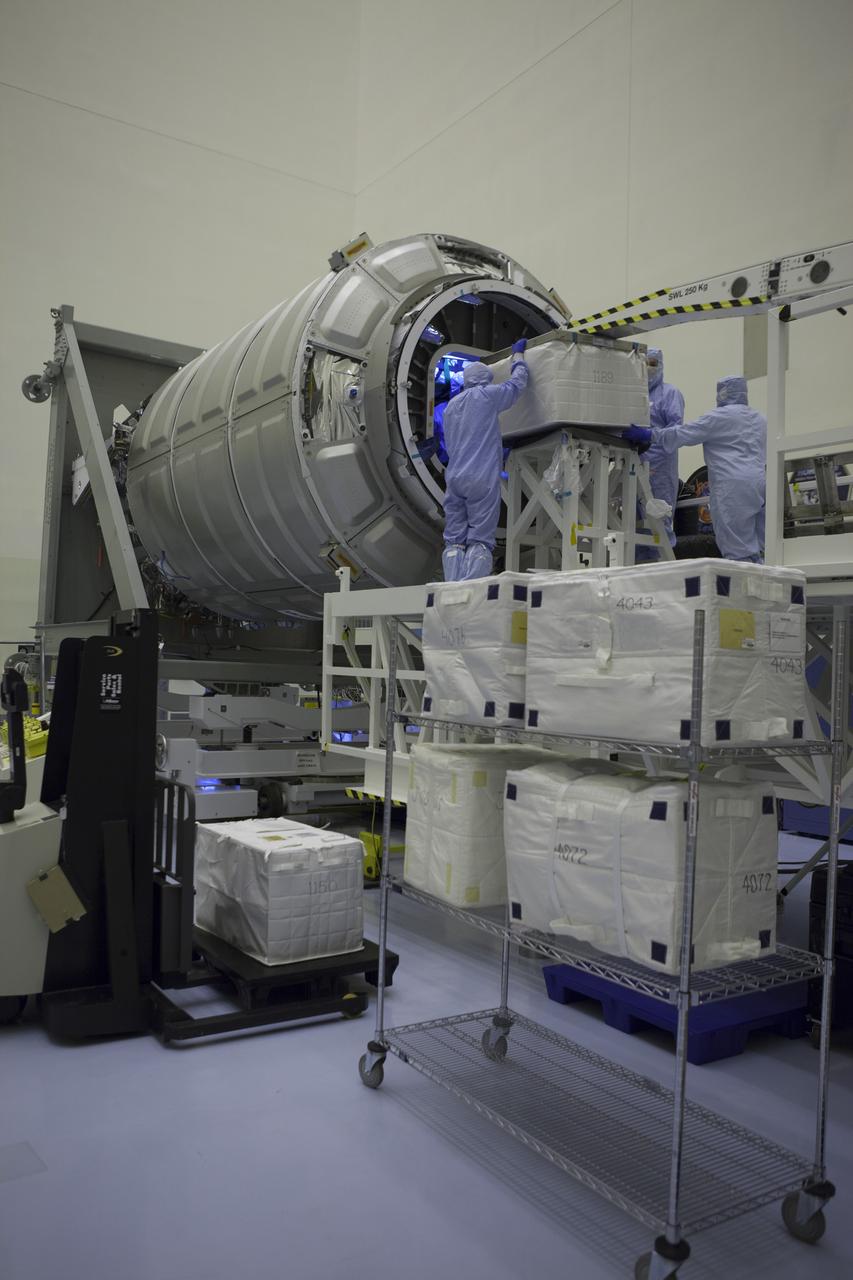Technicians move cargo into the Orbital ATK CRS-6 pressurized cargo module during late stowage inside the Payload Hazardous Servicing Facility at NASA’s Kennedy Space Center in Florida. The spacecraft is scheduled for the upcoming Orbital ATK Commercial Resupply Services-6 mission to deliver hardware and supplies to the International Space Station. The Cygnus is scheduled to lift off atop a United Launch Alliance Atlas V rocket on March 22. 