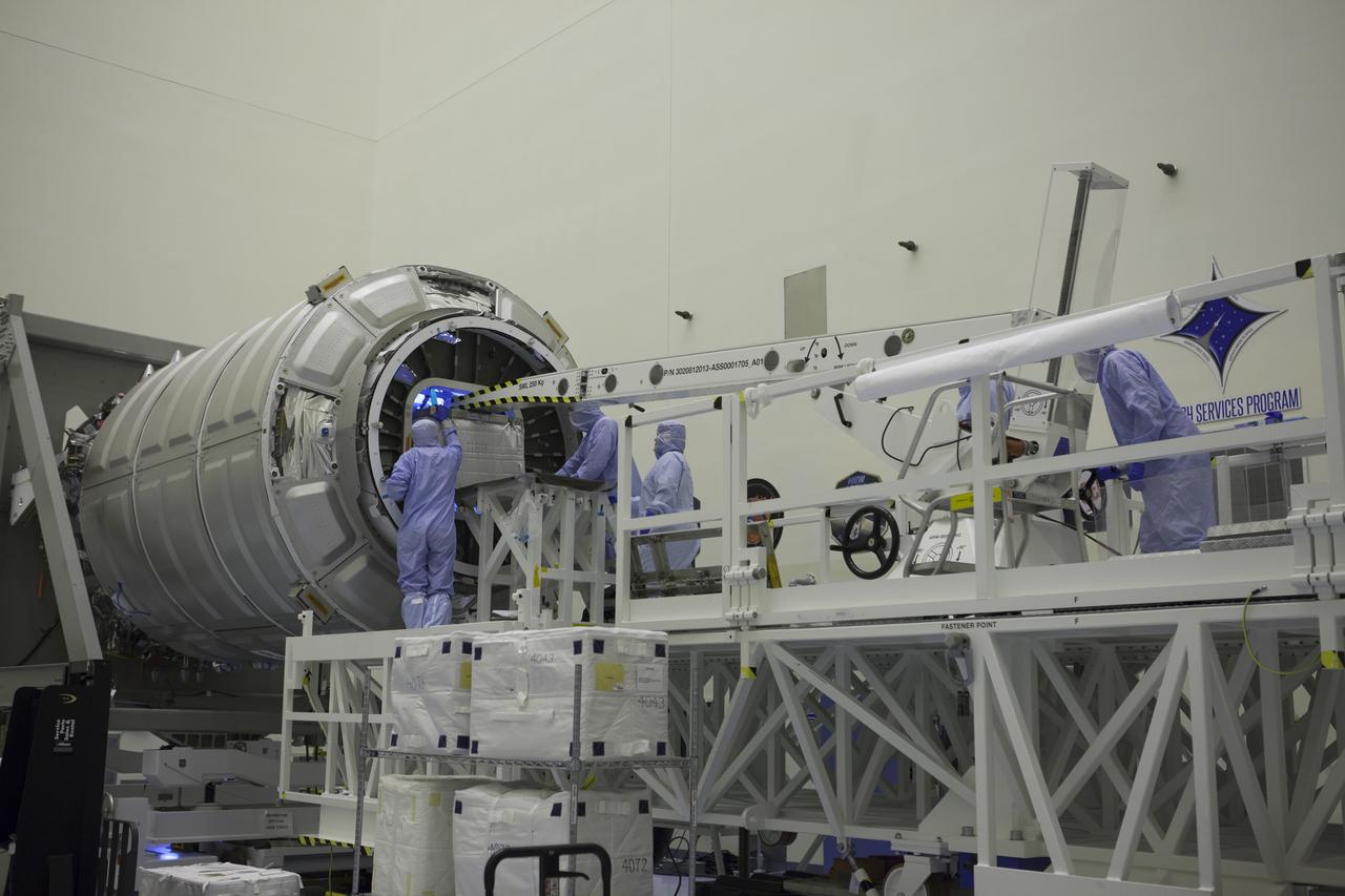 Technicians move cargo into the Orbital ATK CRS-6 pressurized cargo module during late stowage inside the Payload Hazardous Servicing Facility at NASA’s Kennedy Space Center in Florida. The spacecraft is scheduled for the upcoming Orbital ATK Commercial Resupply Services-6 mission to deliver hardware and supplies to the International Space Station. The Cygnus is scheduled to lift off atop a United Launch Alliance Atlas V rocket on March 22. 