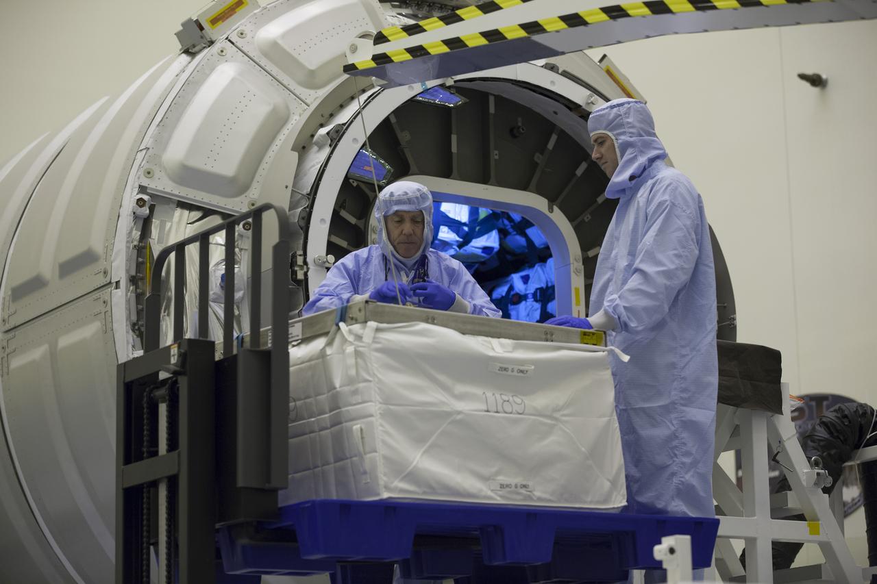 Technicians prepare to move cargo into the Orbital ATK CRS-6 pressurized cargo module during late stowage inside the Payload Hazardous Servicing Facility at NASA’s Kennedy Space Center in Florida. The spacecraft is scheduled for the upcoming Orbital ATK Commercial Resupply Services-6 mission to deliver hardware and supplies to the International Space Station. The Cygnus is scheduled to lift off atop a United Launch Alliance Atlas V rocket on March 22. 