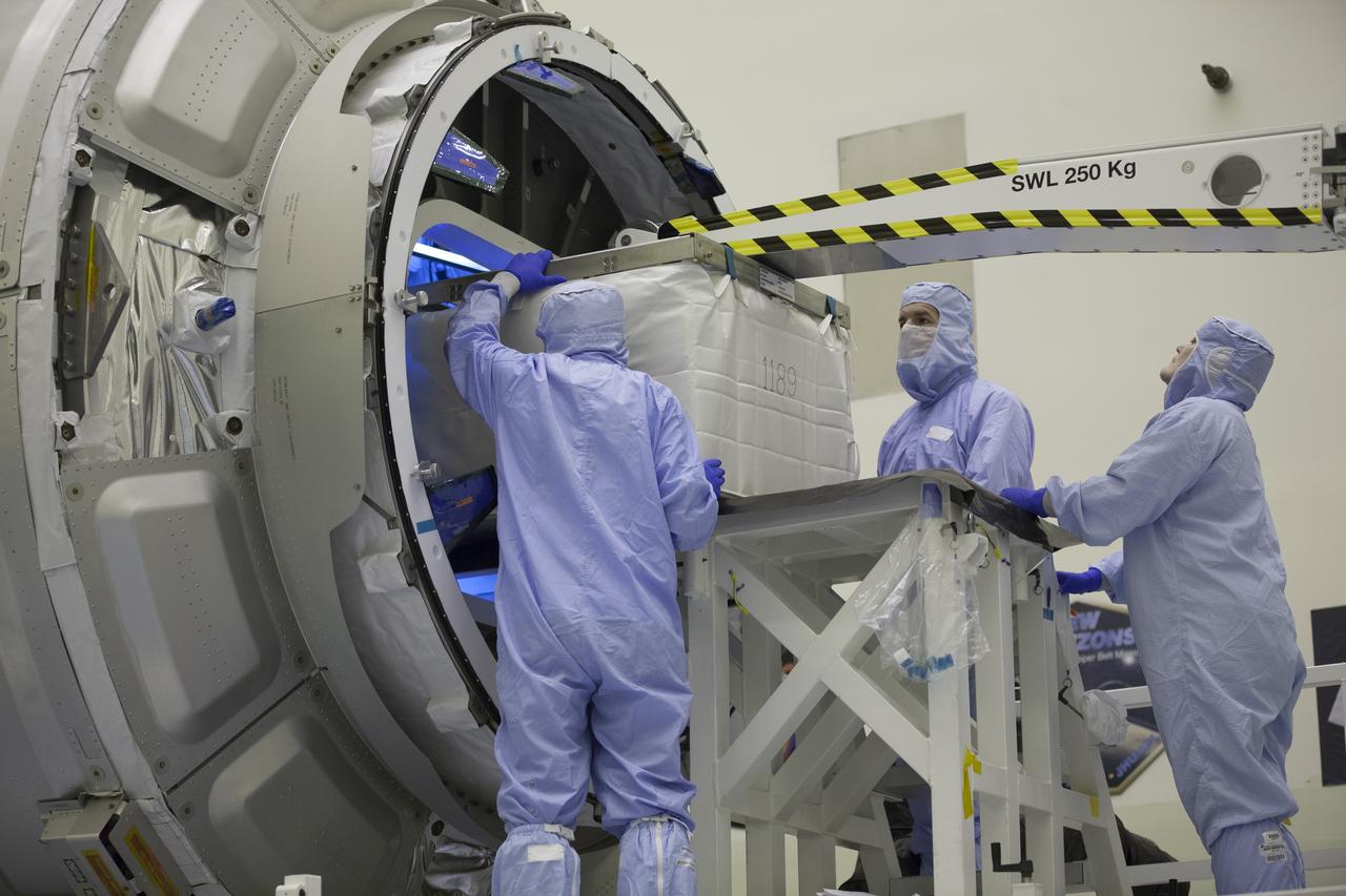 Technicians move cargo into the Orbital ATK CRS-6 pressurized cargo module during late stowage inside the Payload Hazardous Servicing Facility at NASA’s Kennedy Space Center in Florida. The spacecraft is scheduled for the upcoming Orbital ATK Commercial Resupply Services-6 mission to deliver hardware and supplies to the International Space Station. The Cygnus is scheduled to lift off atop a United Launch Alliance Atlas V rocket on March 22. 