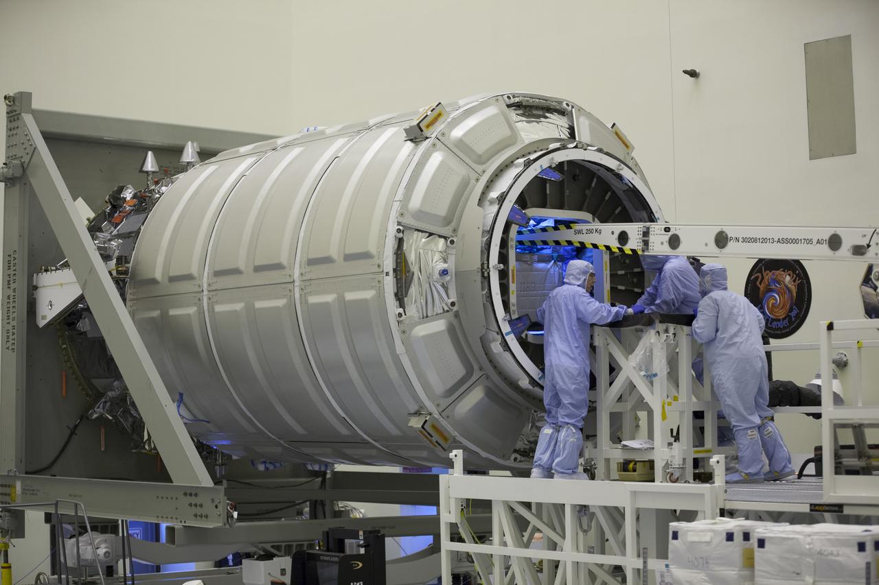 Technicians move cargo into the Orbital ATK CRS-6 pressurized cargo module during late stowage inside the Payload Hazardous Servicing Facility at NASA’s Kennedy Space Center in Florida. The spacecraft is scheduled for the upcoming Orbital ATK Commercial Resupply Services-6 mission to deliver hardware and supplies to the International Space Station. The Cygnus is scheduled to lift off atop a United Launch Alliance Atlas V rocket on March 22. 