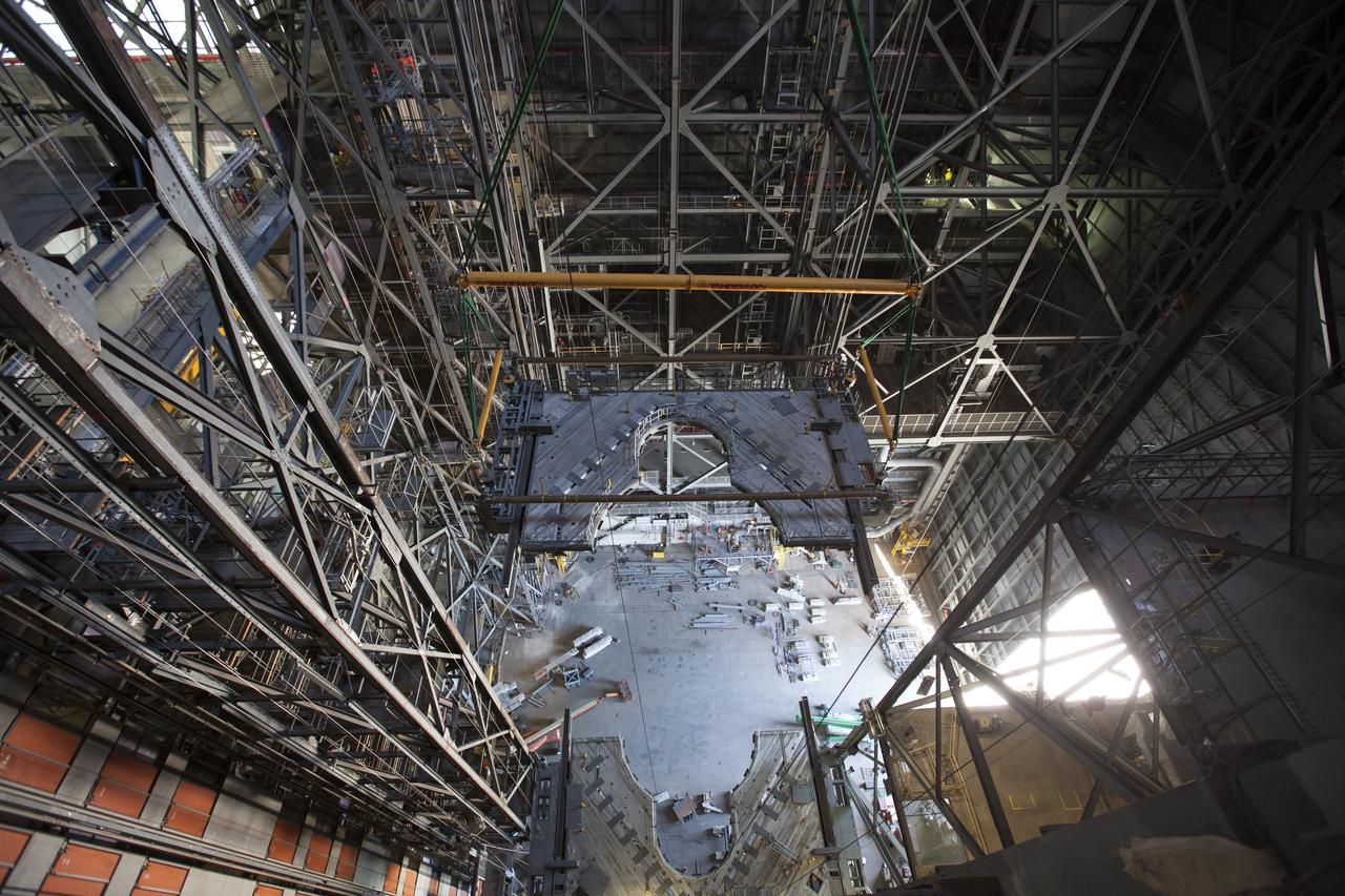A 250-ton crane is used to lower the second half of the K-level work platforms for NASA’s Space Launch System (SLS) rocket into High Bay 3 inside the Vehicle Assembly Building at NASA's Kennedy Space Center in Florida. The platform will be secured about 86 feet above the VAB floor, on tower E of the high bay. The K work platforms will provide access to the SLS core stage and solid rocket boosters during processing and stacking operations on the mobile launcher. The Ground Systems Development and Operations Program is overseeing upgrades and modifications to High Bay 3 to support processing of the SLS and Orion spacecraft. A total of 10 levels of new platforms, 20 platform halves altogether, will surround the SLS rocket and Orion spacecraft.