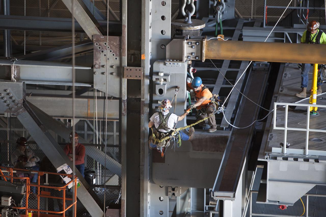 Work is underway to secure the second half of the K-level work platforms for NASA’s Space Launch System (SLS) rocket in High Bay 3 inside the Vehicle Assembly Building. For Spaceport Magazine.