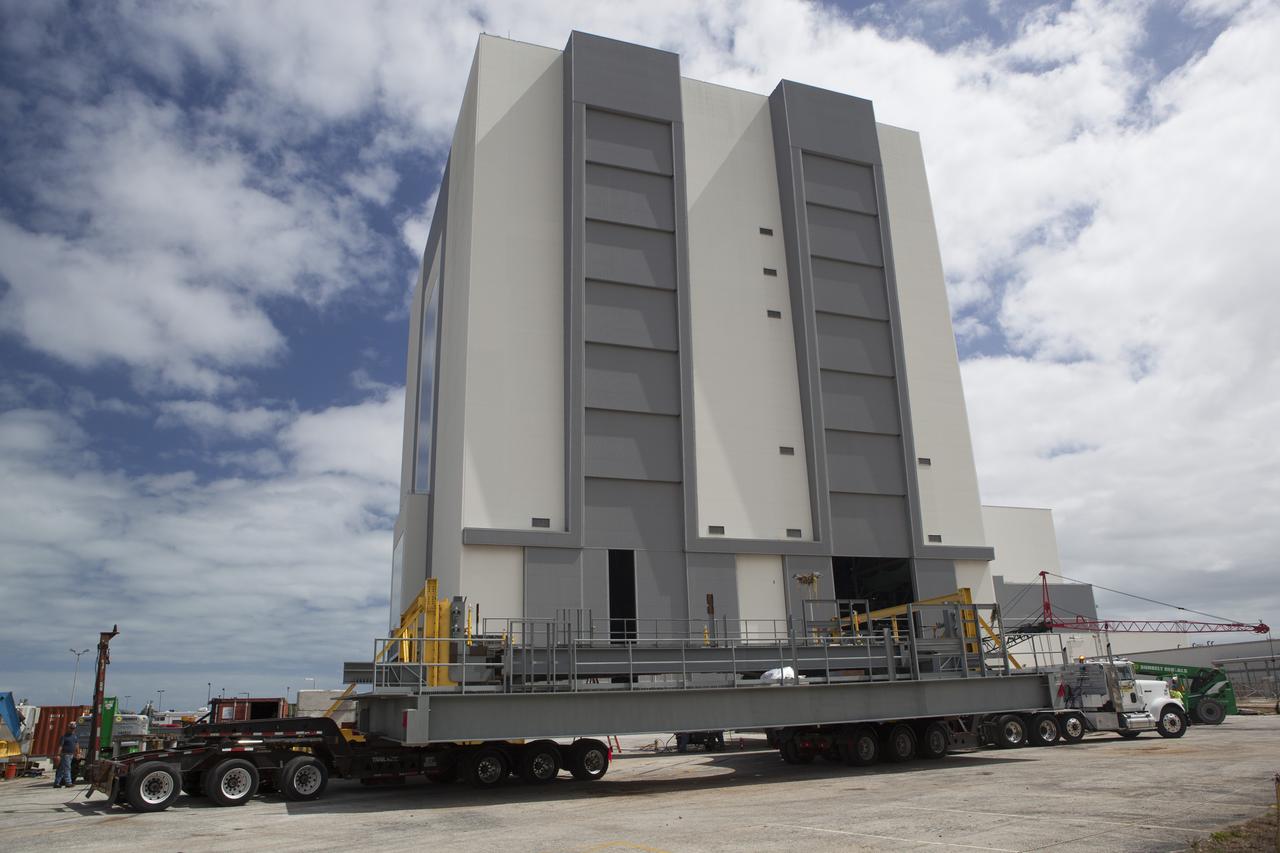 The first half of the F-level work platforms for NASA’s Space Launch System rocket has arrived at the Vehicle Assembly Building at the agency’s Kennedy Space Center in Florida. The Ground Systems Development and Operations Program is overseeing upgrades and modifications to High Bay 3 to support processing of the SLS and Orion spacecraft. A total of 10 levels of new platforms, 20 platform halves altogether, will surround the SLS rocket and Orion spacecraft and provide access for testing and processing. The first three sets of platforms, H, J and K, were delivered to the center last year. 