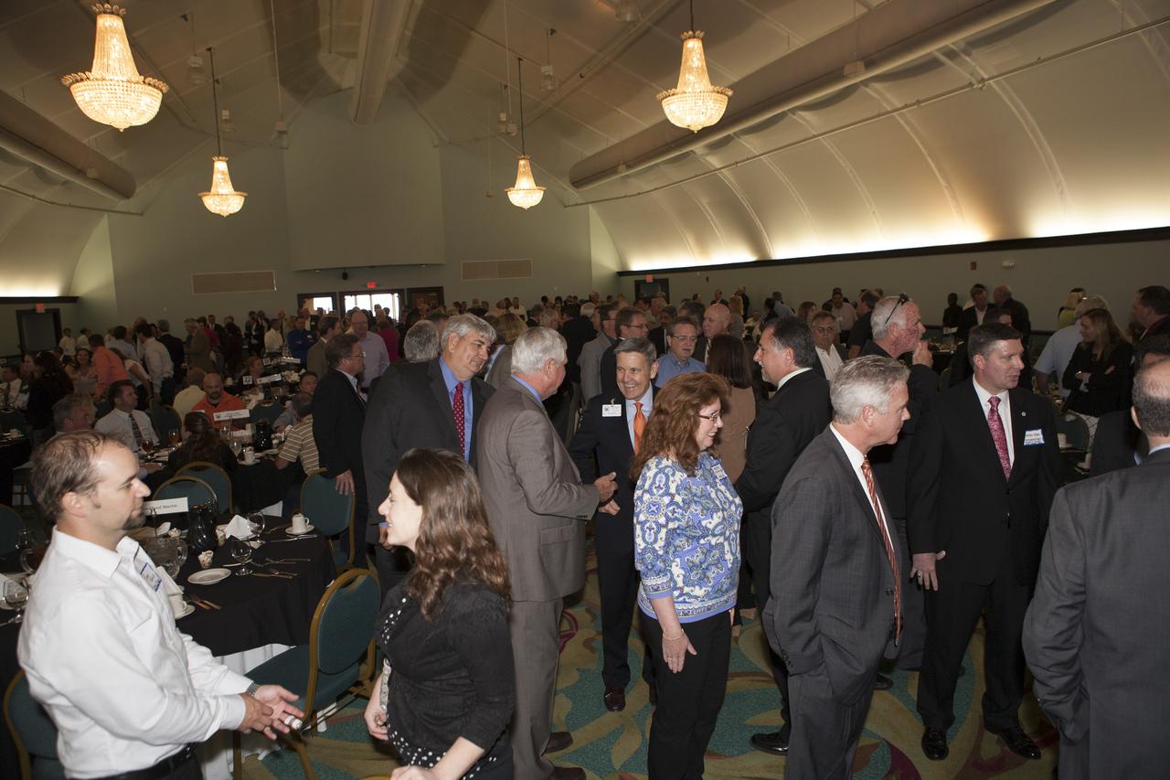 Bob Cabana, center, director of NASA's Kennedy Space Center in Florida, in discussion with members of the National Space Club Florida Committee during the organization's luncheon in Cape Canaveral. Cabana, a former astronaut, was the keynote speaker for the luncheon and delivered an update on Kennedy's future as the premier launch center for NASA and other users.