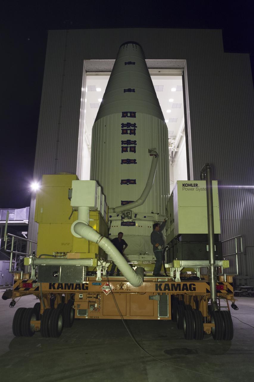 Encapsulated inside its payload fairing, the Cygnus spacecraft for the upcoming Orbital ATK Commercial Resupply Services-6 mission departs the Payload Hazardous Servicing Facility at NASA's Kennedy Space Center in Florida. Mounted atop a KAMAG transporter, Cygnus is being moved to Space Launch Complex-41 at Cape Canaveral Air Force Station where it will be mounted atop a United Launch Alliance Atlas V rocket. The Cygnus is scheduled to lift off atop a United Launch Alliance Atlas V rocket on March 22 to deliver hardware and supplies to the International Space Station.