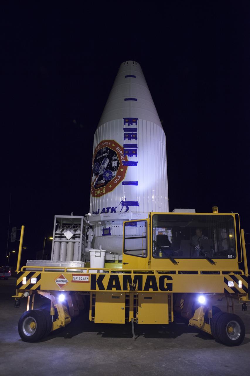 Encapsulated inside its payload fairing, the Cygnus spacecraft for the upcoming Orbital ATK Commercial Resupply Services-6 mission departs the Payload Hazardous Servicing Facility at NASA's Kennedy Space Center in Florida. Mounted atop a KAMAG transporter, Cygnus is being moved to Space Launch Complex-41 at Cape Canaveral Air Force Station where it will be mounted atop a United Launch Alliance Atlas V rocket. The Cygnus is scheduled to lift off atop a United Launch Alliance Atlas V rocket on March 22 to deliver hardware and supplies to the International Space Station.