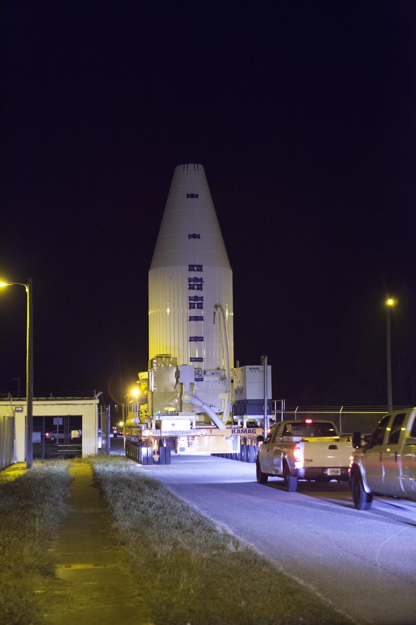 Encapsulated inside its payload fairing, the Cygnus spacecraft for the upcoming Orbital ATK Commercial Resupply Services-6 mission departs the Payload Hazardous Servicing Facility at NASA's Kennedy Space Center in Florida. Mounted atop a KAMAG transporter, Cygnus is being moved to Space Launch Complex-41 at Cape Canaveral Air Force Station where it will be mounted atop a United Launch Alliance Atlas V rocket. The Cygnus is scheduled to lift off atop a United Launch Alliance Atlas V rocket on March 22 to deliver hardware and supplies to the International Space Station.