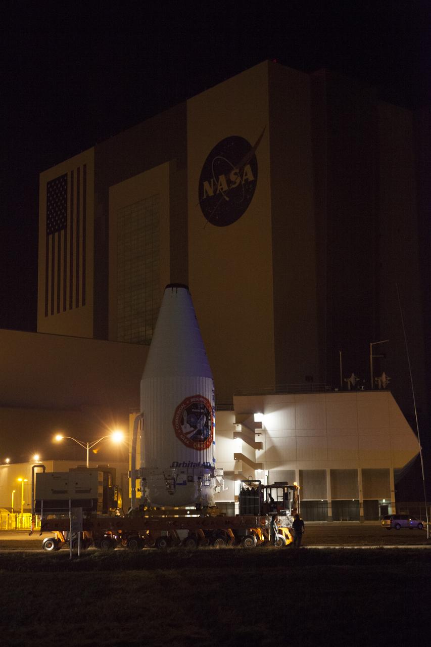 Encapsulated inside its payload fairing, the Cygnus spacecraft for the upcoming Orbital ATK Commercial Resupply Services-6 mission moves past the Vehicle Assembly Building at NASA's Kennedy Space Center in Florida. Mounted atop a KAMAG transporter, Cygnus is being moved to Space Launch Complex-41 at Cape Canaveral Air Force Station where it will be mounted atop a United Launch Alliance Atlas V rocket. The Cygnus is scheduled to lift off atop a United Launch Alliance Atlas V rocket on March 22 to deliver hardware and supplies to the International Space Station.