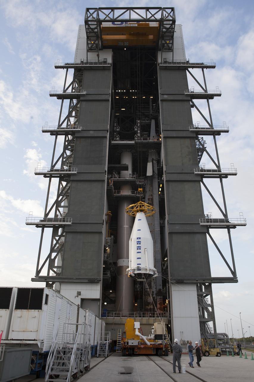 Encapsulated inside its payload fairing, the Cygnus spacecraft for the upcoming Orbital ATK Commercial Resupply Services-6 is lifted to be mated atop a United Launch Alliance Atlas V rocket in the Vertical Integration Facility at Launch Complex-41 at Cape Canaveral Air Force Station. The Cygnus is scheduled to lift off atop a United Launch Alliance Atlas V rocket on March 22 to deliver hardware and supplies to the International Space Station.