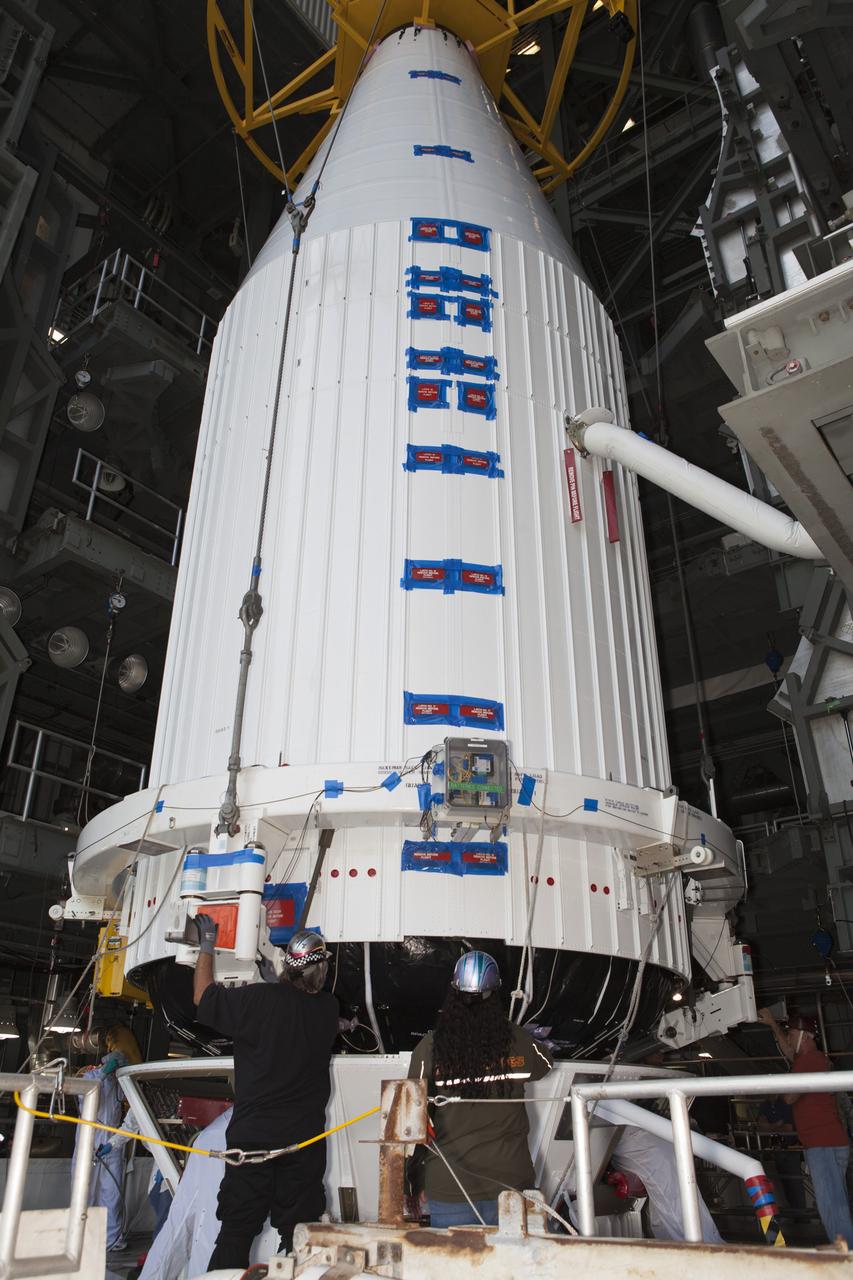 Encapsulated inside its payload fairing, the Cygnus spacecraft for the upcoming Orbital ATK Commercial Resupply Services-6 is positioned for mating atop a United Launch Alliance Atlas V rocket in the Vertical Integration Facility at Launch Complex-41 at Cape Canaveral Air Force Station. The Cygnus is scheduled to lift off atop a United Launch Alliance Atlas V rocket on March 22 to deliver hardware and supplies to the International Space Station.
