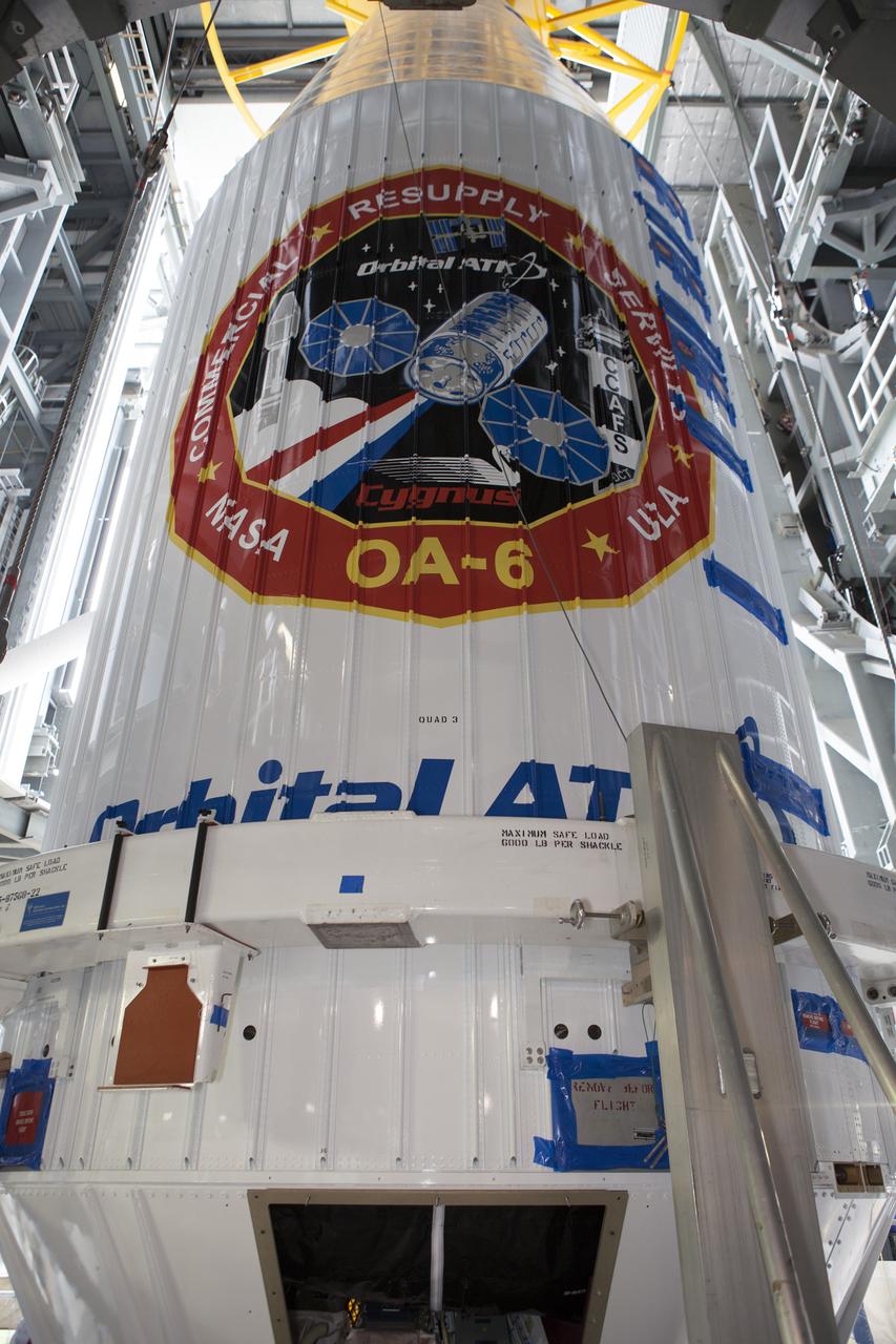Encapsulated inside its payload fairing, the Cygnus spacecraft for the upcoming Orbital ATK Commercial Resupply Services-6 is mated atop a United Launch Alliance Atlas V rocket in the Vertical Integration Facility at Launch Complex-41 at Cape Canaveral Air Force Station. The Cygnus is scheduled to lift off atop a United Launch Alliance Atlas V rocket on March 22 to deliver hardware and supplies to the International Space Station.
