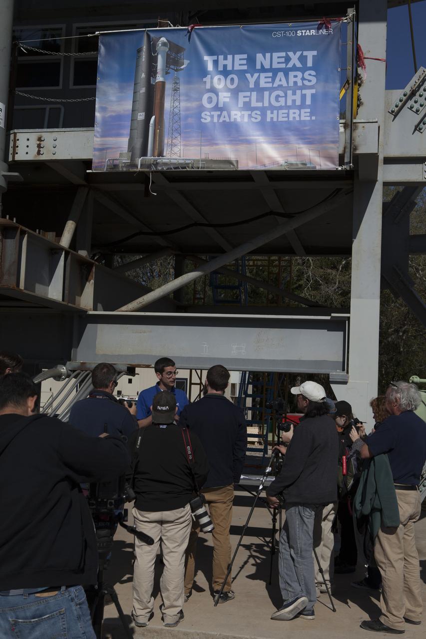 Steve Hirst, Launch Operations Group for United Launch Alliance, speaks to news media about the Crew Access Arm under construction at a yard near NASA's Kennedy Space Center in Florida. The arm and white room are being built to bridge the space between the Crew Access Tower and the hatch to Boeing's CST-100 Starliner spacecraft as it stands atop a ULA Atlas V rocket at Space Launch Complex 41 before flight. Partnering with NASA's Commercial Crew Program, Boeing is one of two companies building a new, privately owned and operated space system to carry astronauts to the International Space Station. 