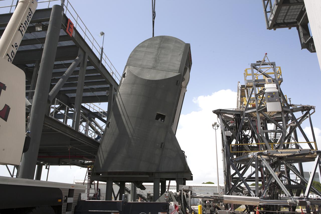 A crane lowers the first Tail Service Mast Umbilical (TSMU) onto a test stand at the Launch Equipment Test Facility at NASA’s Kennedy Space Center in Florida. Two TSMUs will provide liquid propellants and power to the Space Launch System (SLS) rocket’s core stage engine. Both TSMUs will connect to the zero-level deck on the mobile launcher, providing fuel and electricity to the SLS rocket before it launches on Exploration Mission 1. The TSMU will undergo testing and validation at the LETF to verify it is functioning properly. The center’s Engineering Directorate and the Ground Systems Development and Operations Program are overseeing processing and testing of the umbilicals. 