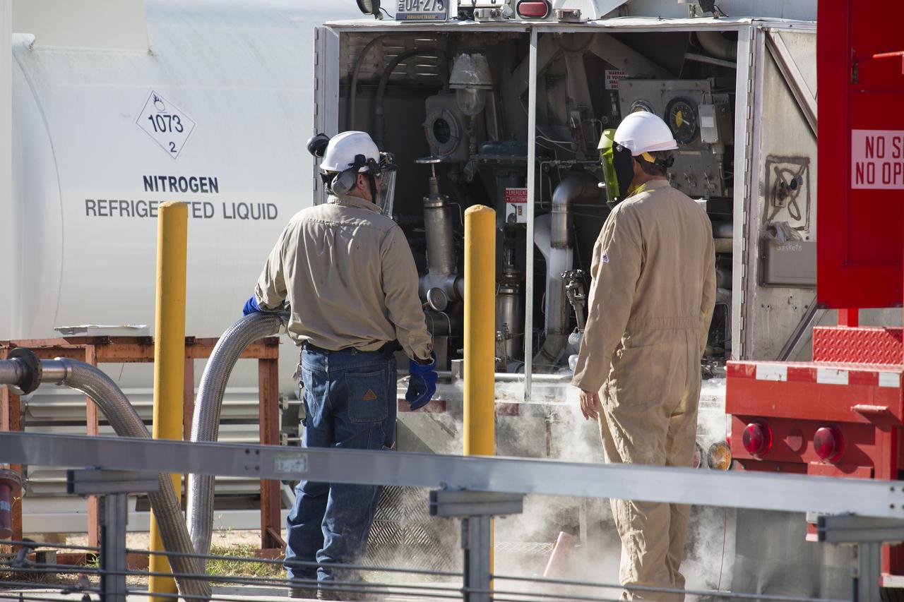 Technicians with Praxair pressurize the hydrogen trailer before offloading liquid hydrogen during a test of the Ground Operations Demo Unit for liquid hydrogen at NASA's Kennedy Space Center in Florida. The system includes a 33,000 gallon liquid hydrogen storage tank with an internal cold heat exchanger supplied from a cryogenic refrigerator. The primary goal of the testing is to achieve a liquid hydrogen zero boil-off capability. The system was designed, installed and tested by a team of civil servants and contractors from the center's Cryogenic Test Laboratory, with support from engineers at NASA's Glenn Research Center in Cleveland and Stennis Space Center in Mississippi. It may be applicable for use by the Ground Systems Development and Operations Program at Launch Pad 39B.