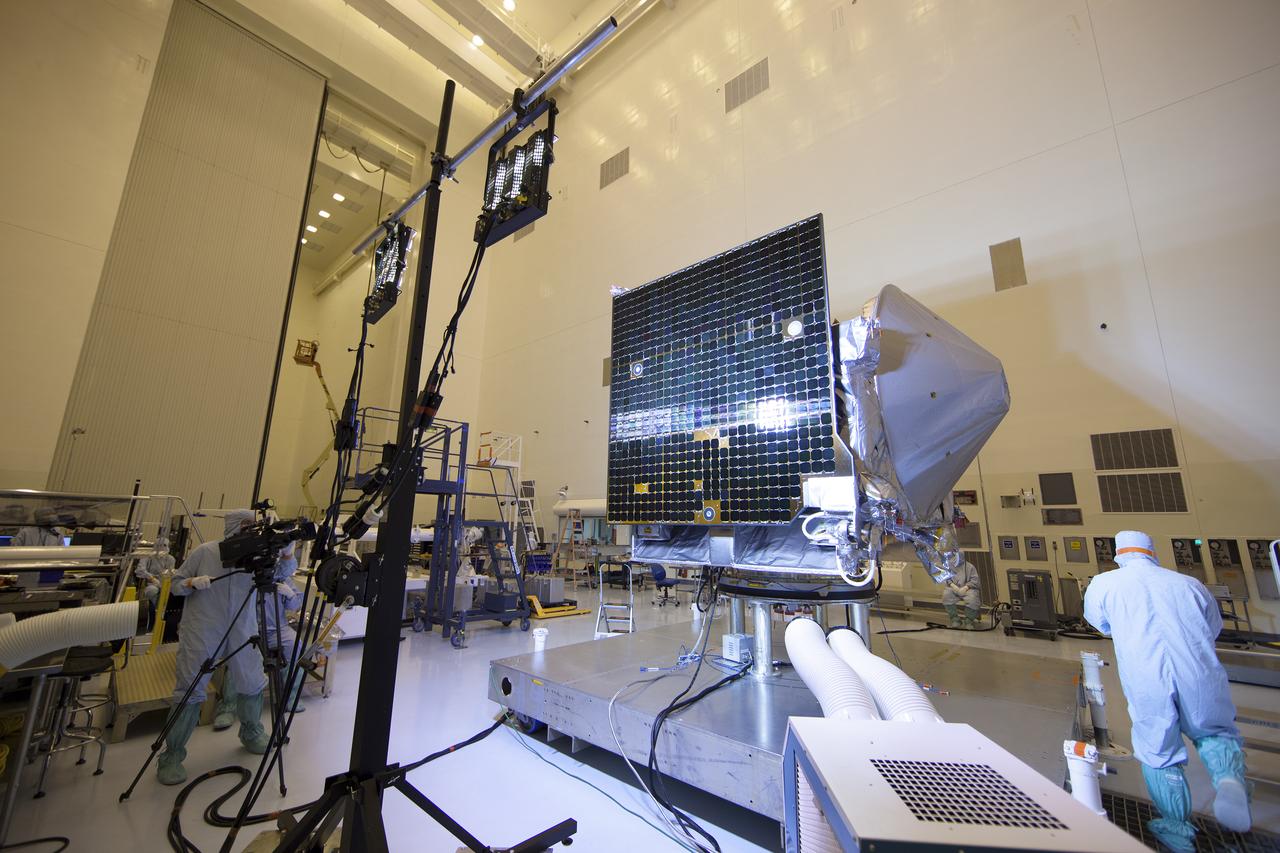 Inside the Payload Hazardous Servicing Facility at NASA's Kennedy Space Center in Florida, illumination testing is underway on the power -producing solar arrays for the agency’s Origins, Spectral Interpretation, Resource Identification, Security-Regolith Explorer, or OSIRIS-REx spacecraft. Targeted for liftoff Sept. 8, 2016, OSIRIS-Rex will be the first U.S. mission to sample an asteroid, retrieve at least two ounces of surface material and return it to Earth for study. The asteroid, Bennu, may hold clues to the origin of the solar system and the source of water and organic molecules found on Earth.