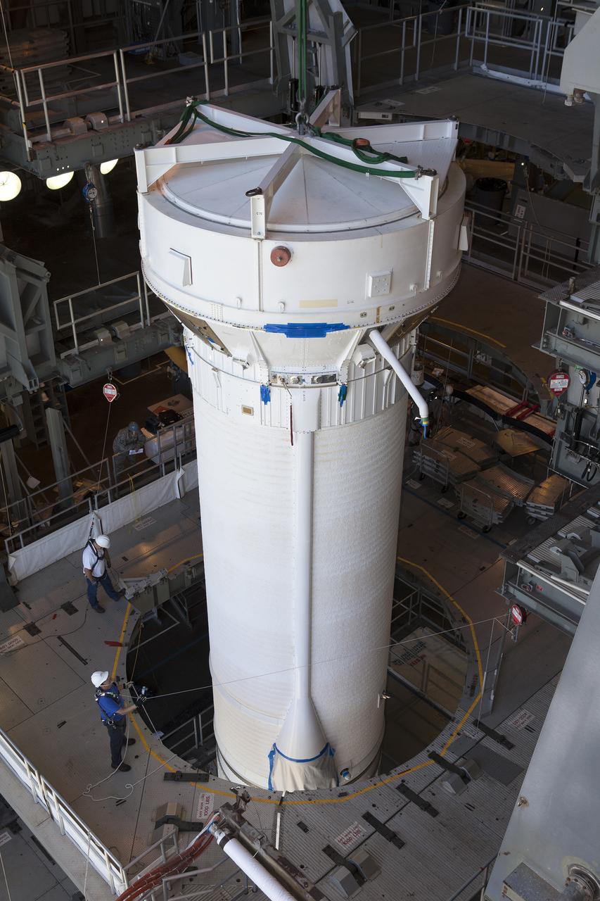 Team members prepare to attach a Centaur upper stage to the United Launch Alliance Atlas V rocket first stage booster at Space Launch Complex 41 on Florida’s Cape Canaveral Air Force Station. The rocket will boost NASA’s Origins, Spectral Interpretation, Resource Identification, Security-Regolith Explorer, or OSIRIS-REx spacecraft. Targeted for liftoff Sept. 8, 2016, OSIRIS-Rex will be the first U.S. mission to sample an asteroid, retrieve at least two ounces of surface material and return it to Earth for study. The asteroid, Bennu, may hold clues to the origin of the solar system and the source of water and organic molecules found on Earth.