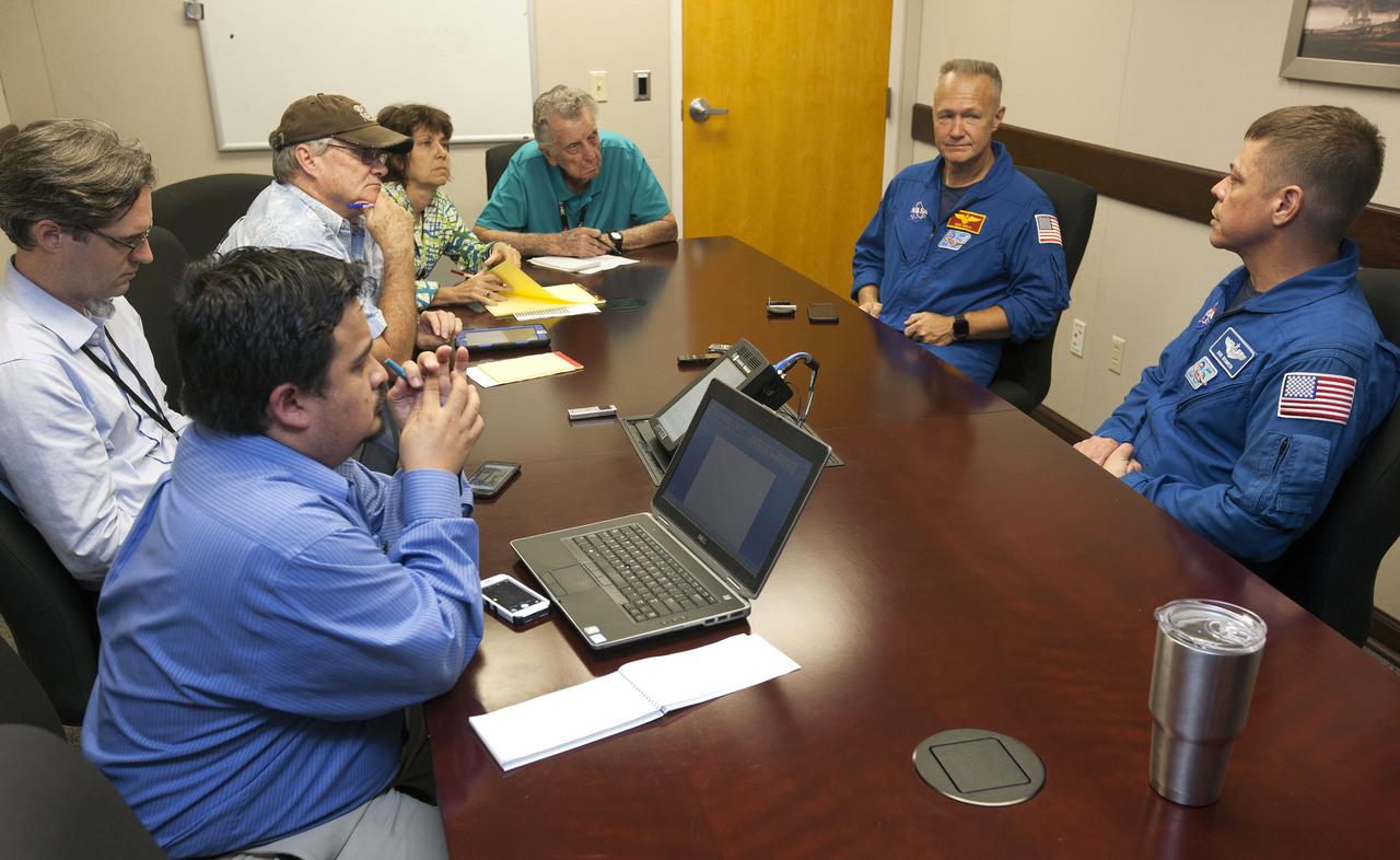 Astronauts selected to train for the flight tests of NASA’s Commercial Crew Program talked to members of the media at the News Center at NASA’s Kennedy Space Center in Florida. From left are astronauts Doug Hurley and Bob Behnken.