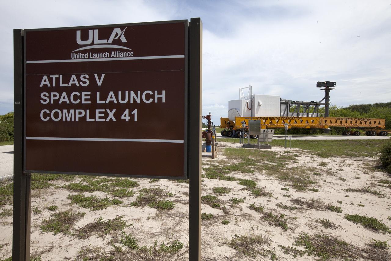 A heavy-lift transport truck, carrying the Crew Access Arm for Space Launch Complex 41, travels along the road toward Complex 41 at Cape Canaveral Air Force Station in Florida. The arm will be installed on the Complex 41 Crew Access Tower. It will be used as a bridge by astronauts to board Boeing's CST-100 Starliner spacecraft as it stands on the launch pad atop a United Launch Alliance Atlas V rocket. 
