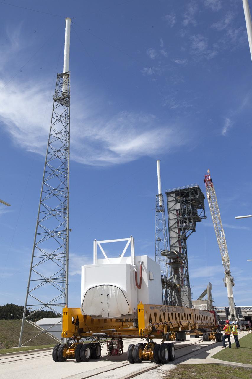A heavy-lift transport truck, carrying the Crew Access Arm for Space Launch Complex 41, backs up toward Complex 41 at Cape Canaveral Air Force Station in Florida. The arm will be installed on the Complex 41 Crew Access Tower. It will be used as a bridge by astronauts to board Boeing's CST-100 Starliner spacecraft as it stands on the launch pad atop a United Launch Alliance Atlas V rocket.