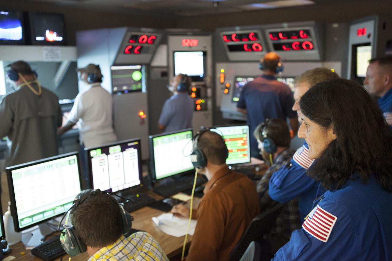 NASA astronaut Suni Williams watches as Aerojet Rocketdyne test team engineers direct the test-firing of an RL10 engine at the company's facility in West Palm Beach, Florida. The engine will be one of two used for the Centaur upper stage during a United Launch Alliance Atlas V mission to launch Boeing's CST-100 Starliner on a flight test carrying a crew. The engine was test-fired as part of acceptance testing to confirm the engine is ready for flight.