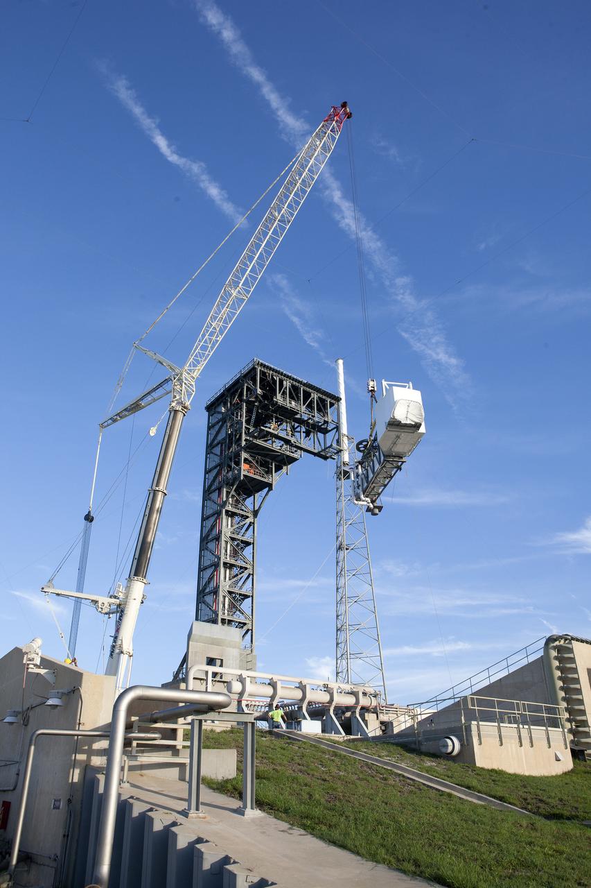 A crane lifts the Crew Access Arm and White Room for Boeing's CST-100 Starliner spacecraft to be attached to the Crew Access Tower at Cape Canaveral Air Force Station’s Space Launch Complex 41. When attached to the 200-foot tall Crew Access Tower, the arm will serve as the connection that astronauts will walk through prior to boarding the Starliner spacecraft when stacked atop a United Launch Alliance Atlas V rocket. This installation completes the major construction of the first new Crew Access Tower to be built at the Cape since the Apollo era. Under a Commercial Crew Transportation Capability (CCtCap) contract with NASA, Boeing’s Starliner system will be certified by NASA's Commercial Crew Program to fly crews to and from the International Space Station.