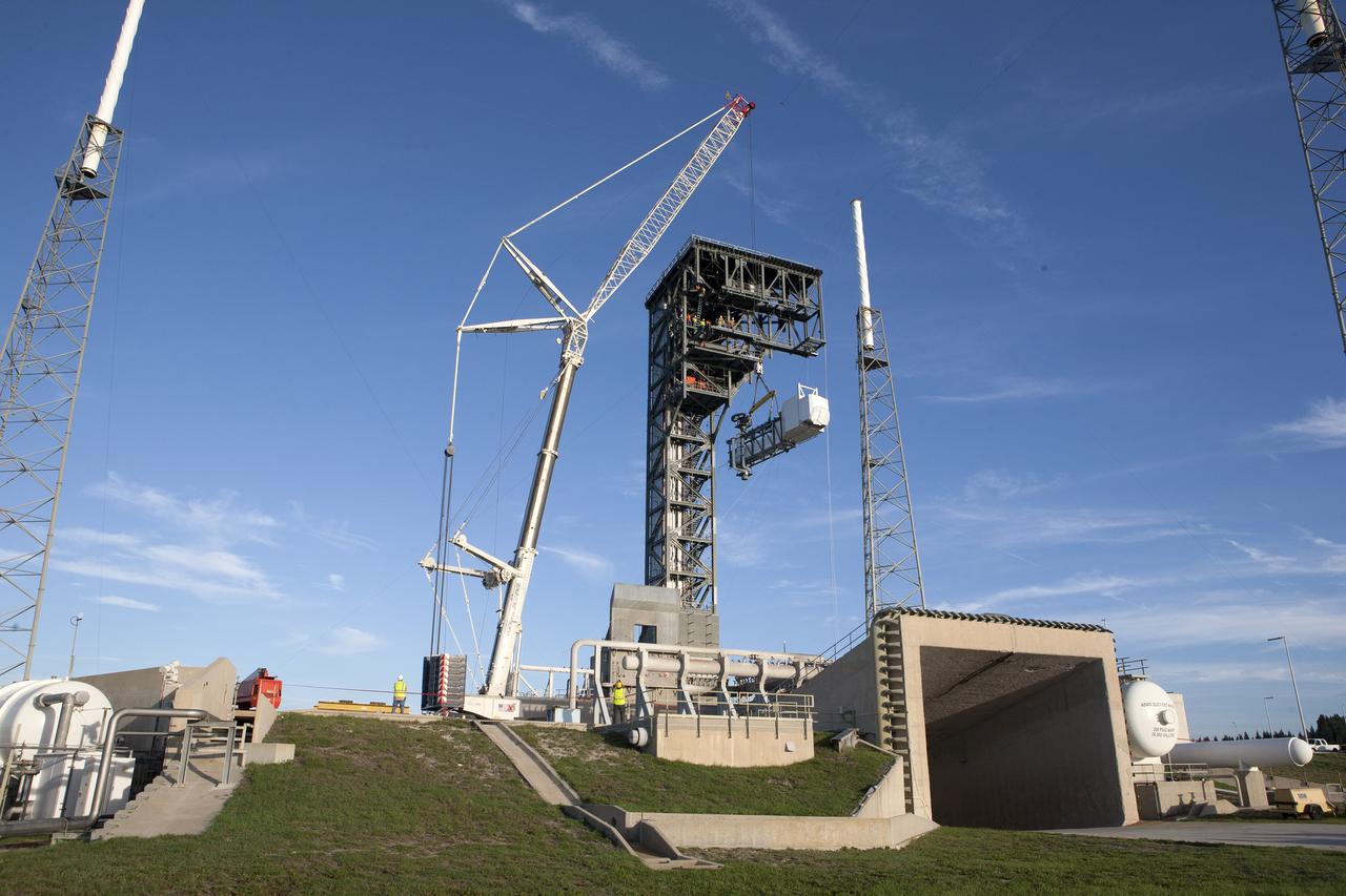 A crane lifts the Crew Access Arm and White Room for Boeing's CST-100 Starliner spacecraft to be attached to the Crew Access Tower at Cape Canaveral Air Force Station’s Space Launch Complex 41. When attached to the 200-foot tall Crew Access Tower, the arm will serve as the connection that astronauts will walk through prior to boarding the Starliner spacecraft when stacked atop a United Launch Alliance Atlas V rocket. This installation completes the major construction of the first new Crew Access Tower to be built at the Cape since the Apollo era. Under a Commercial Crew Transportation Capability (CCtCap) contract with NASA, Boeing’s Starliner system will be certified by NASA's Commercial Crew Program to fly crews to and from the International Space Station.