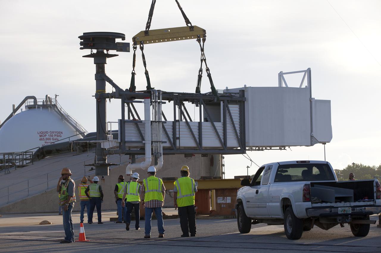 A crane is attached to the Crew Access Arm and White Room for Boeing's CST-100 Starliner spacecraft to be attached to the Crew Access Tower at Cape Canaveral Air Force Station’s Space Launch Complex 41. When attached to the 200-foot tall Crew Access Tower, the arm will serve as the connection that astronauts will walk through prior to boarding the Starliner spacecraft when stacked atop a United Launch Alliance Atlas V rocket. This installation completes the major construction of the first new Crew Access Tower to be built at the Cape since the Apollo era. Under a Commercial Crew Transportation Capability (CCtCap) contract with NASA, Boeing’s Starliner system will be certified by NASA's Commercial Crew Program to fly crews to and from the International Space Station.