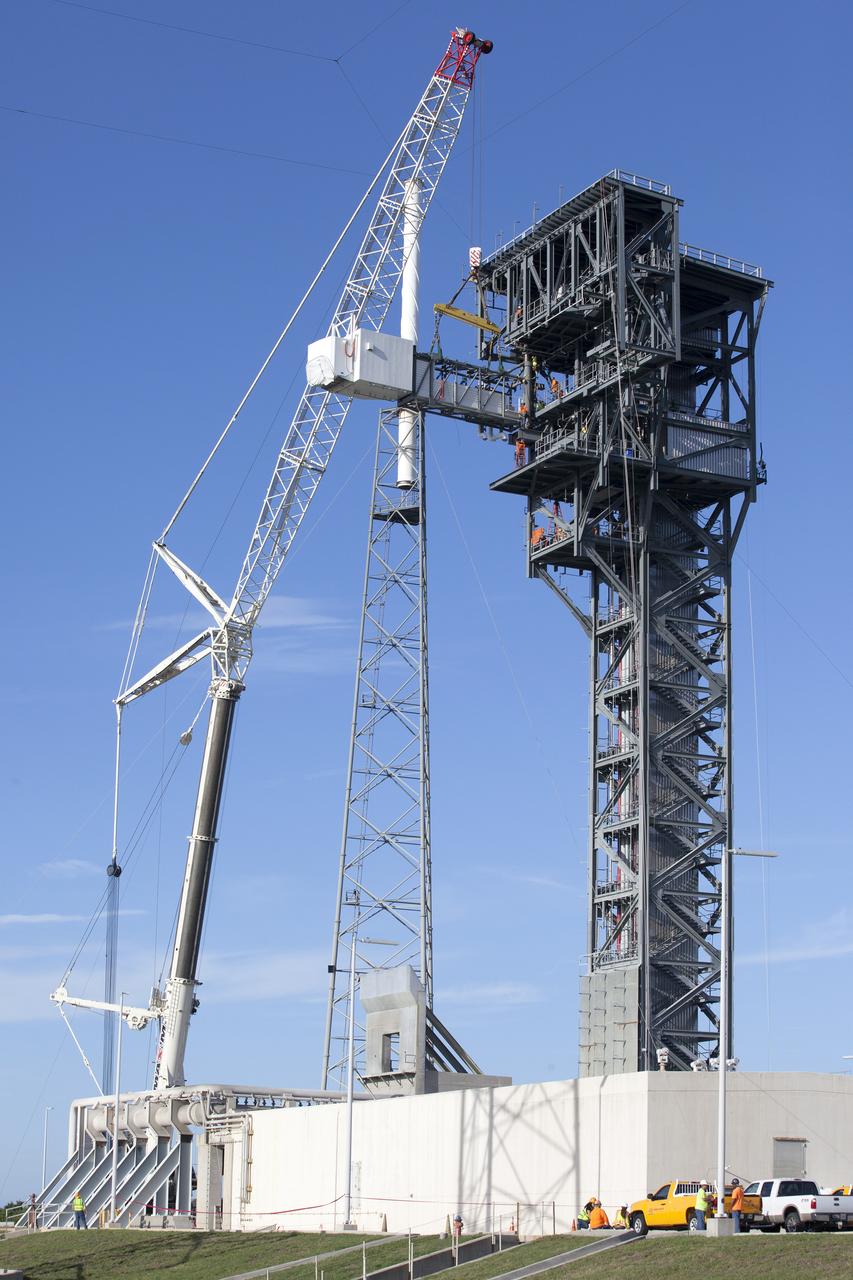 The Crew Access Arm and White Room for Boeing's CST-100 Starliner are attached to the Crew Access Tower at Cape Canaveral Air Force Station’s Space Launch Complex 41. The arm will serve as the connection that astronauts will walk through prior to boarding the spacecraft when stacked atop a United Launch Alliance Atlas V rocket. The installation completes the major construction of the first new Crew Access Tower to be built at the Cape since the Apollo era. Under a Commercial Crew Transportation Capability (CCtCap) contract with NASA, Boeing’s Starliner system will be certified by NASA's Commercial Crew Program to fly crews to and from the International Space Station.