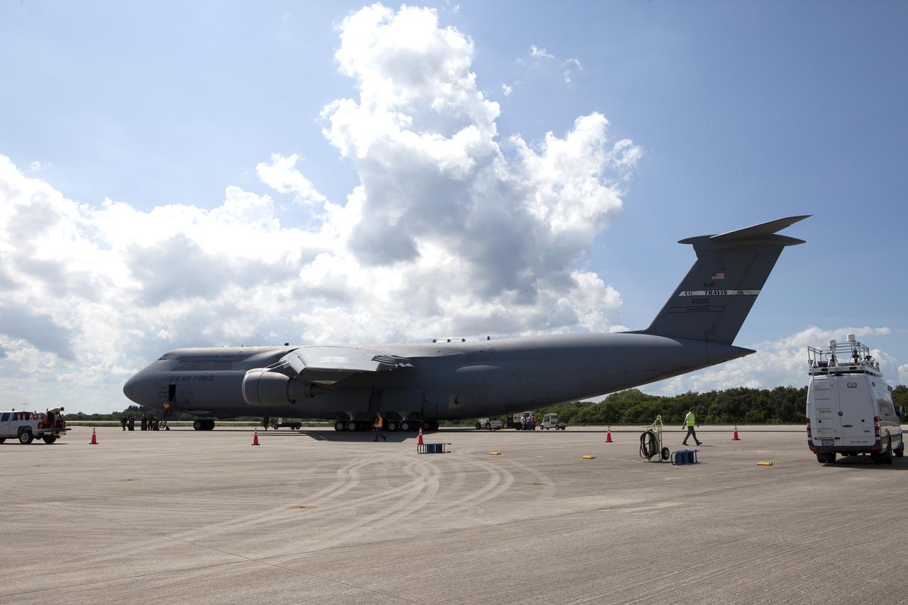 An Air Force C-5 Galaxy transport plane rolls to a stop at the Shuttle Landing Facility at NASA's Kennedy Space Center in Florida to deliver the GOES-R spacecraft for launch processing. The GOES series are weather satellites operated by NOAA to enhance forecasts. The spacecraft is to launch aboard a United Launch Alliance Atlas V rocket in November.