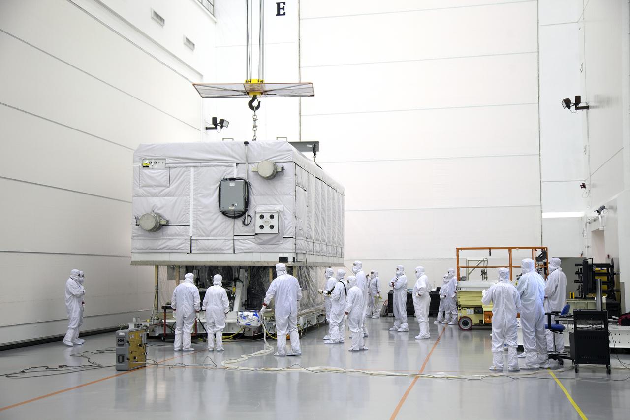 The shipping container is lifted off the GOES-R spacecraft inside the Astrotech payload processing facility in Titusville, Florida near NASA’s Kennedy Space Center. GOES-R will be the first satellite in a series of next-generation NOAA Geostationary Operational Environmental Satellites. The spacecraft is to launch aboard a United Launch Alliance Atlas V rocket in November.