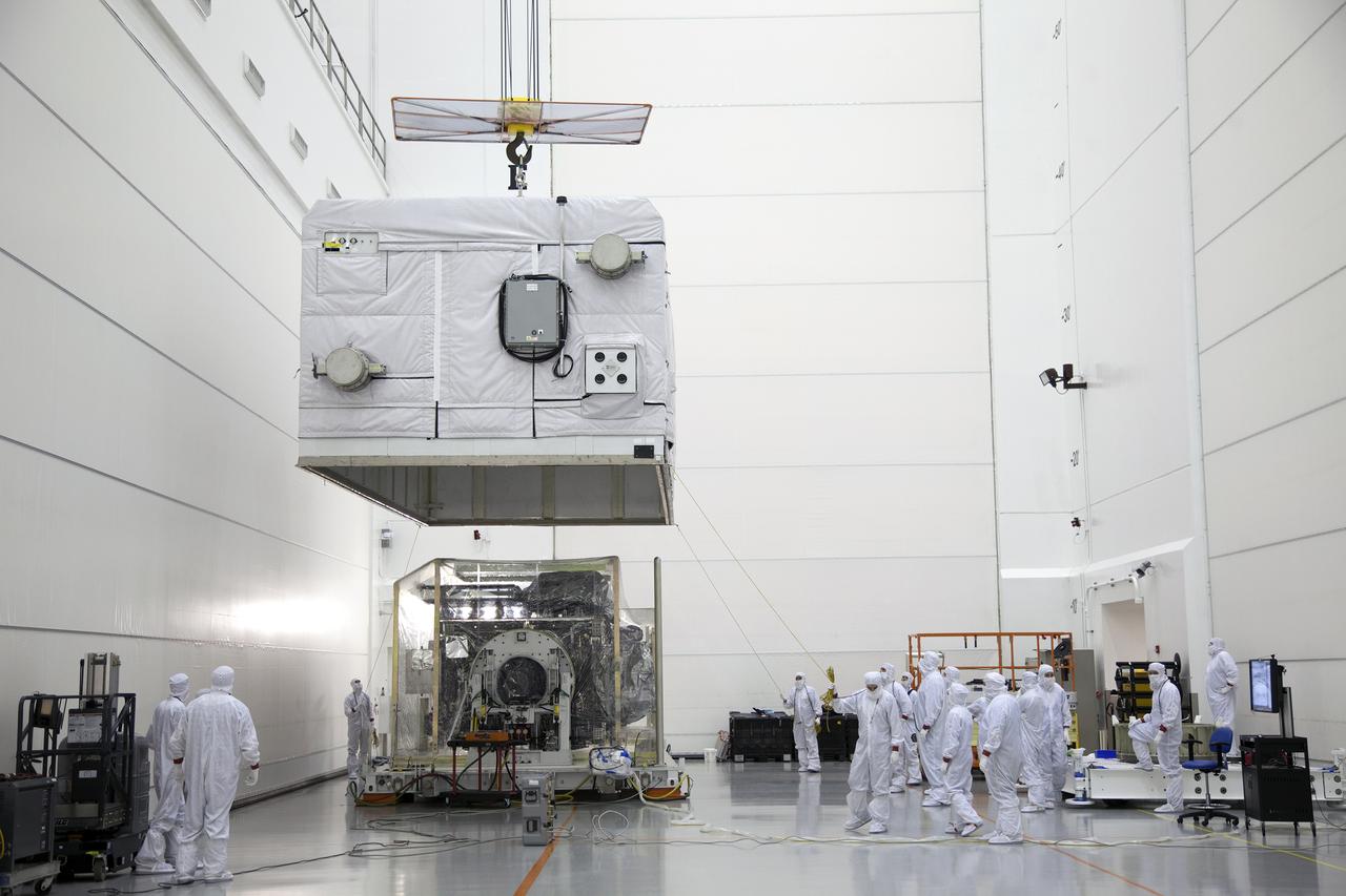 The shipping container is lifted off the GOES-R spacecraft inside the Astrotech payload processing facility in Titusville, Florida near NASA’s Kennedy Space Center. GOES-R will be the first satellite in a series of next-generation NOAA Geostationary Operational Environmental Satellites. The spacecraft is to launch aboard a United Launch Alliance Atlas V rocket in November.