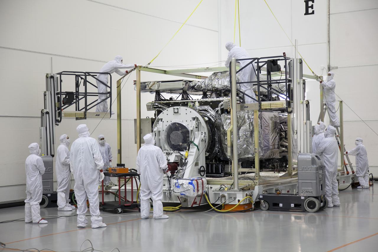 The GOES-R spacecraft is revealed following its uncrating inside the Astrotech payload processing facility in Titusville, Florida near NASA’s Kennedy Space Center. GOES-R will be the first satellite in a series of next-generation NOAA Geostationary Operational Environmental Satellites. The spacecraft is to launch aboard a United Launch Alliance Atlas V rocket in November.