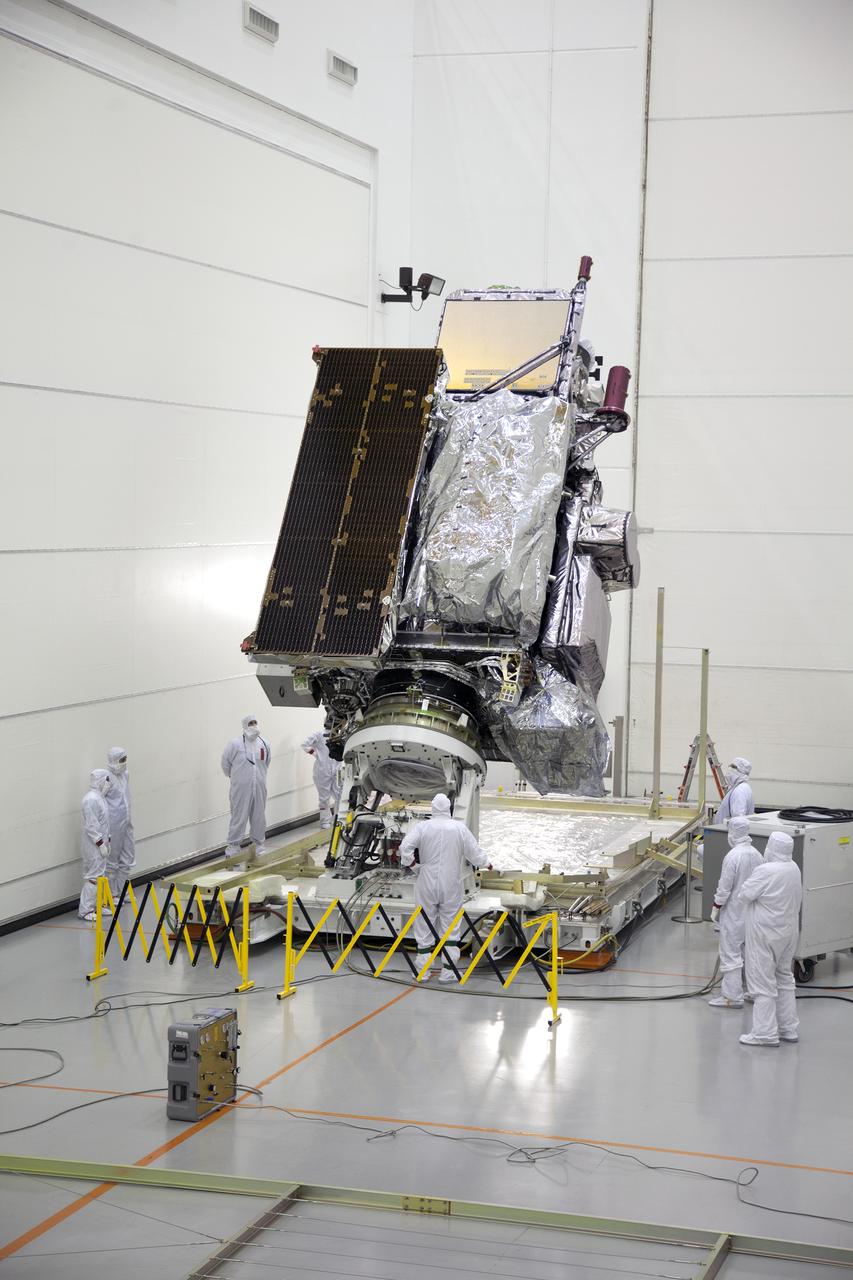 Team members monitor progress as the GOES-R spacecraft is raised to vertical inside the Astrotech payload processing facility in Titusville, Florida near NASA’s Kennedy Space Center. GOES-R will be the first satellite in a series of next-generation NOAA Geostationary Operational Environmental Satellites. The spacecraft is to launch aboard a United Launch Alliance Atlas V rocket in November.