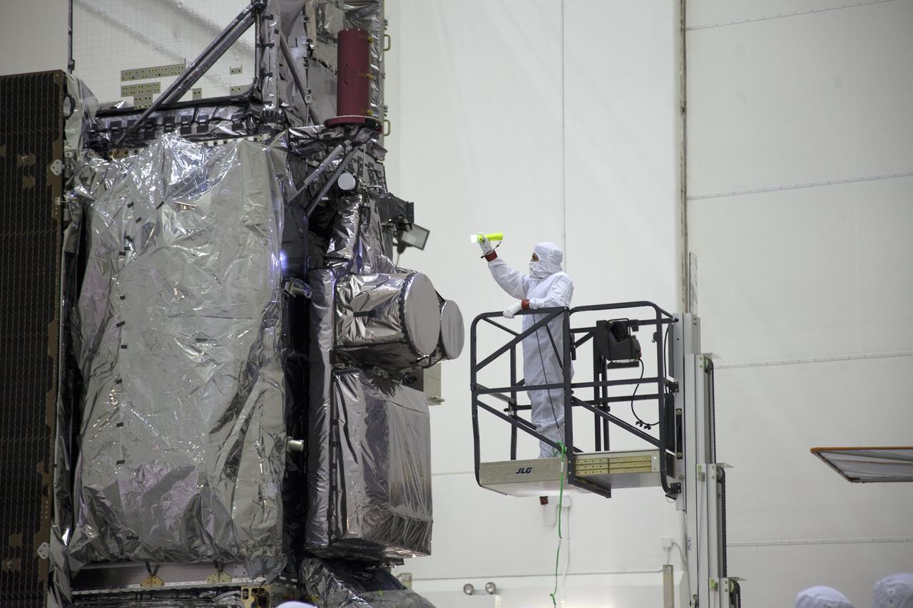 The GOES-R spacecraft is inspected after being uncrated and raised to vertical inside the Astrotech payload processing facility in Titusville, Florida near NASA’s Kennedy Space Center. GOES-R will be the first satellite in a series of next-generation NOAA Geostationary Operational Environmental Satellites. The spacecraft is to launch aboard a United Launch Alliance Atlas V rocket in November.