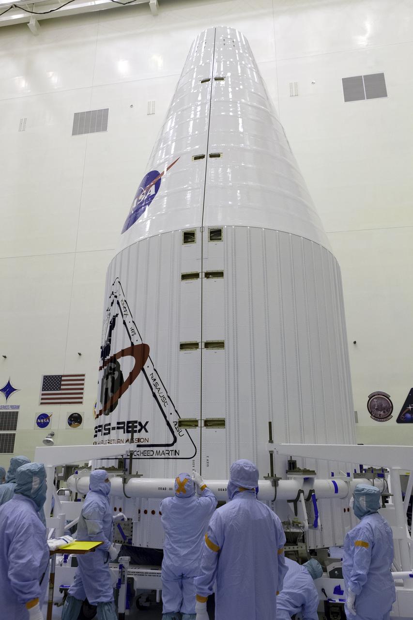 Inside the Payload Hazardous Servicing Facility at NASA's Kennedy Space Center in Florida, engineers and technicians encapsulate the agency’s Origins, Spectral Interpretation, Resource Identification, Security-Regolith Explorer, or OSIRIS-REx spacecraft in its payload fairing. Targeted for liftoff at 7:05 p.m. EDT Sept. 8, 2016, OSIRIS-Rex will be the first U.S. mission to sample an asteroid, retrieve at least two ounces of surface material and return it to Earth for study. The asteroid, Bennu, may hold clues to the origin of the solar system and the source of water and organic molecules found on Earth.