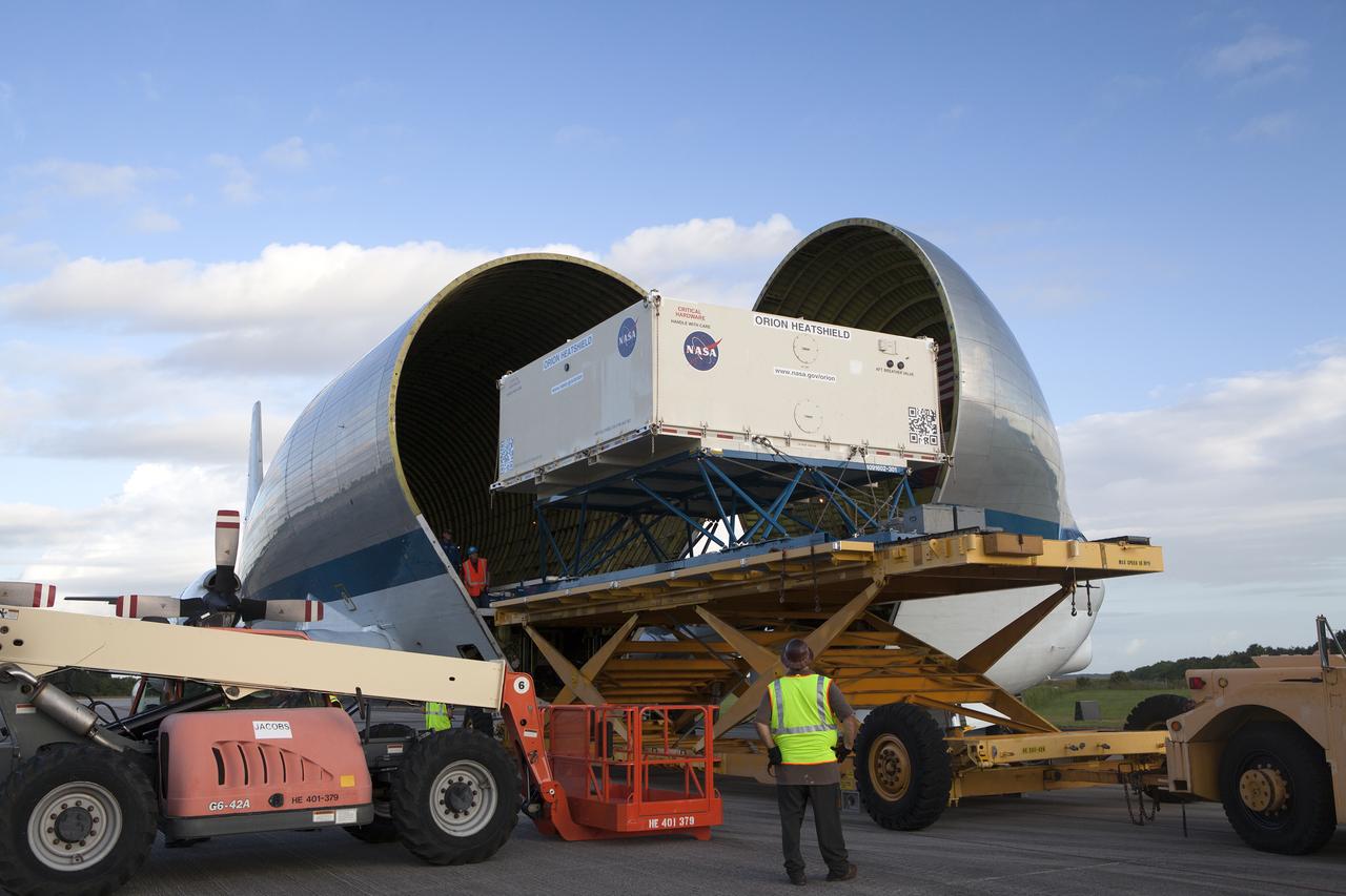 The shipping container carrying the Orion heat shield for Exploration Mission 1 (EM-1) is offloaded from NASA’s Super Guppy aircraft at the Shuttle Landing Facility, managed and operated by Space Florida, at the agency’s Kennedy Space Center in Florida. The heat shield will be transported to the Neil Armstrong Operations and Checkout Building high bay for processing. The heat shield arrived from Lockheed Martin’s manufacturing facility near Denver. The Orion spacecraft will launch atop NASA’s Space Launch System rocket on EM-1, an uncrewed test flight, in 2018. 
