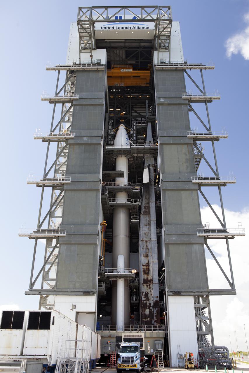 The OSIRIS-REx spacecraft, enclosed in a payload fairing, is positioned atop a United Launch Alliance Atlas V rocket at Space Launch Complex 41 at Cape Canaveral Air Force Station. The rocket that is to lift OSIRIS-REx into space was stacked at SLC-41 so the spacecraft and fairing could be hoisted and bolted to the rocket promptly. The spacecraft will be sent to rendezvous with, survey and take a sample from an asteroid called Bennu.