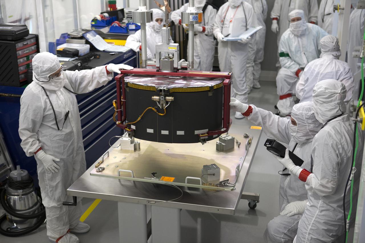 Team members prepare the Advanced Base Line Imager, the primary optical instrument, for installation on the Geostationary Operational Environmental Satellite (GOES-R) inside the Astrotech payload processing facility in Titusville, Florida near NASA’s Kennedy Space Center. GOES-R will be the first satellite in a series of next-generation NOAA GOES Satellites. The spacecraft is to launch aboard a United Launch Alliance Atlas V rocket in November.