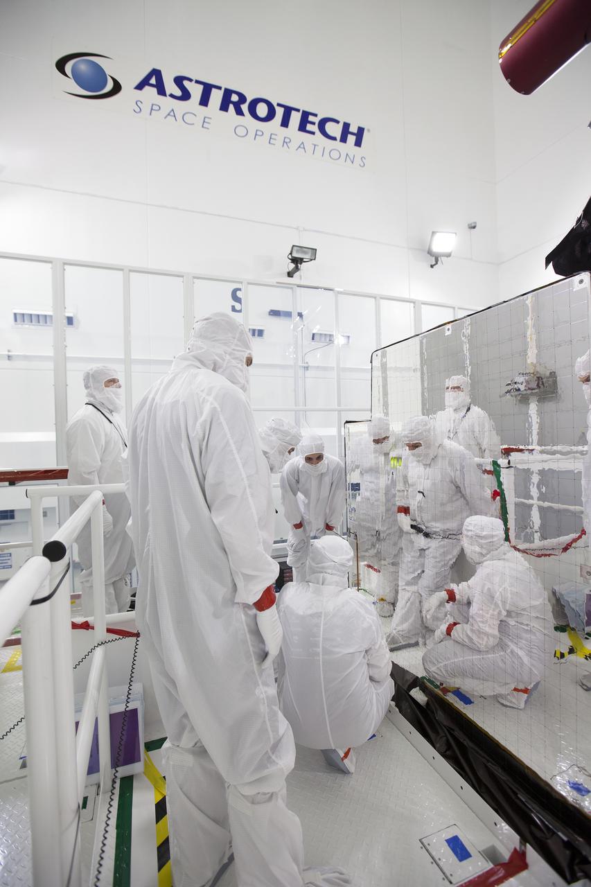 Team members prepare for an optics test on the Advanced Baseline Imager, the primary optical instrument, on the Geostationary Operational Environmental Satellite (GOES-R) inside the Astrotech payload processing facility in Titusville, Florida near NASA’s Kennedy Space Center. Carbon dioxide will be sprayed on the imager to clean it and test its sensitivity. GOES-R will be the first satellite in a series of next-generation NOAA GOES Satellites. The spacecraft is to launch aboard a United Launch Alliance Atlas V rocket in November. 