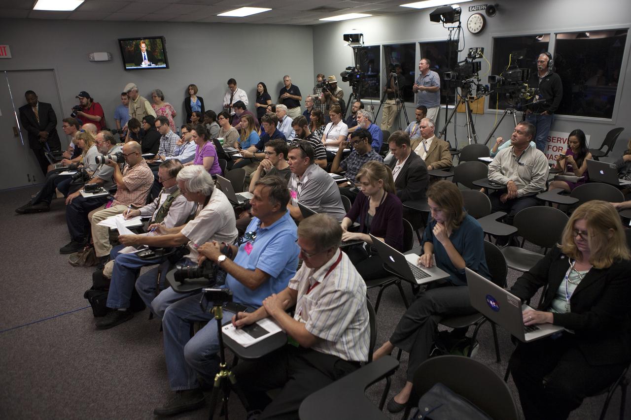 In the Kennedy Space Center’s Press Site auditorium, members of the media participated with NASA and industry leaders in a prelaunch news conference for the agency’s Origins, Spectral Interpretation, Resource Identification, Security-Regolith Explorer, or OSIRIS-REx spacecraft.