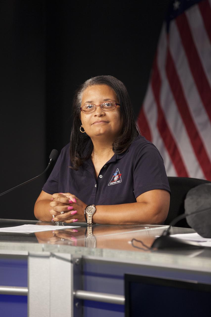 In the Kennedy Space Center’s Press Site auditorium, Nancy Neal-Jones of NASA Communications at the Goddard Space Flight Center in Greenbelt, Maryland, moderates a media briefing on science experiments involved in NASA’s Origins, Spectral Interpretation, Resource Identification, Security-Regolith Explorer, or OSIRIS-REx spacecraft.