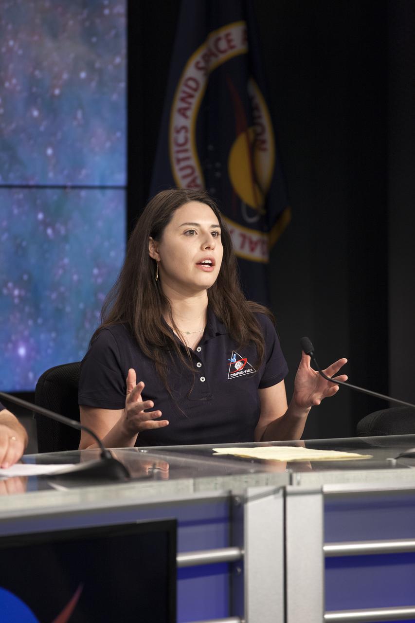 In the Kennedy Space Center’s Press Site auditorium, Daniella DellaGiustina, OSIRIS-REx lead image processing scientist at the University of Arizona, Tucson, speaks to members of the media during a briefing on science experiments involved in NASA’s Origins, Spectral Interpretation, Resource Identification, Security-Regolith Explorer, or OSIRIS-REx spacecraft.
