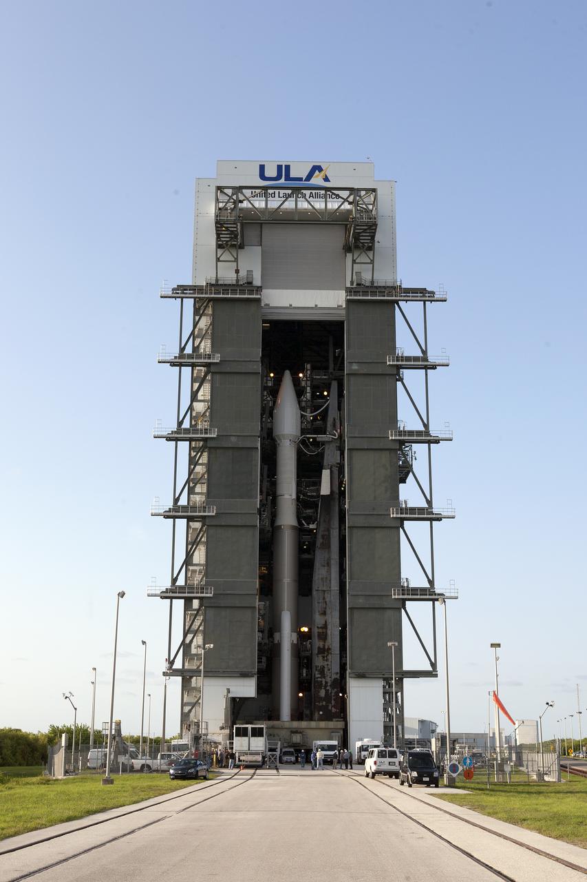 A United Launch Alliance Atlas V rocket begins to roll out of the Vertical Integration Facility to Space Launch Complex 41 at Cape Canaveral Air Force Station in Florida. The launch vehicle will boost NASA’s Origins, Spectral Interpretation, Resource Identification, Security-Regolith Explorer, or OSIRIS-REx spacecraft. This will be the first U.S. mission to sample an asteroid, retrieve at least two ounces of surface material and return it to Earth for study. The asteroid, Bennu, may hold clues to the origin of the solar system and the source of water and organic molecules found on Earth.
