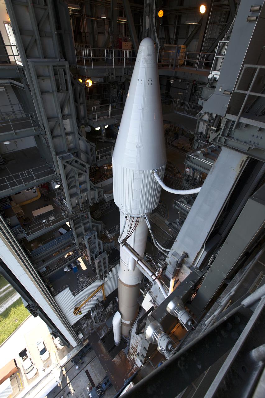 In a view from above, a United Launch Alliance Atlas V rocket begins to roll out of the Vertical Integration Facility to Space Launch Complex 41 at Cape Canaveral Air Force Station in Florida. The launch vehicle will boost NASA’s Origins, Spectral Interpretation, Resource Identification, Security-Regolith Explorer, or OSIRIS-REx spacecraft. This will be the first U.S. mission to sample an asteroid, retrieve at least two ounces of surface material and return it to Earth for study. The asteroid, Bennu, may hold clues to the origin of the solar system and the source of water and organic molecules found on Earth.