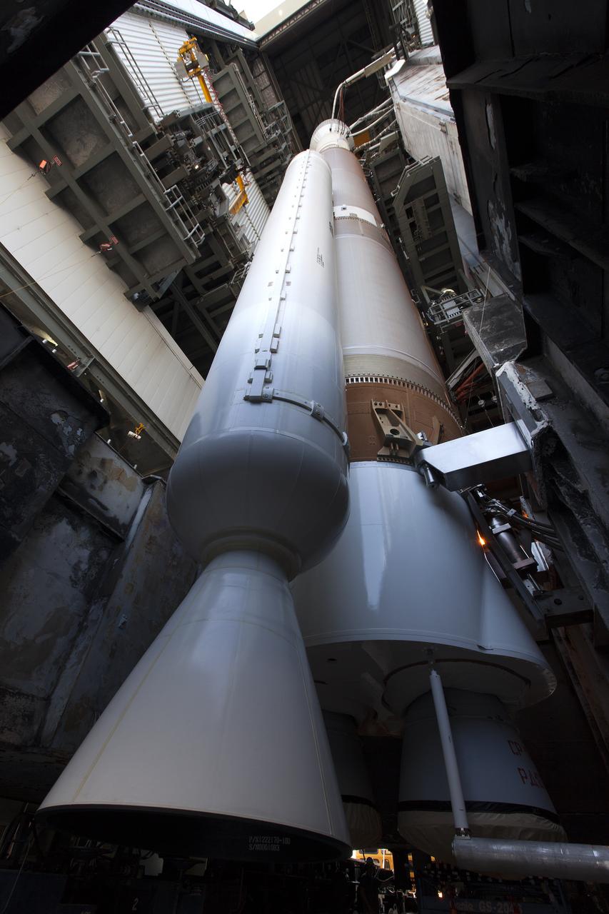 In a view from ground level looking up, a United Launch Alliance Atlas V rocket begins to roll out of the Vertical Integration Facility to Space Launch Complex 41 at Cape Canaveral Air Force Station in Florida. The launch vehicle will boost NASA’s Origins, Spectral Interpretation, Resource Identification, Security-Regolith Explorer, or OSIRIS-REx spacecraft. This will be the first U.S. mission to sample an asteroid, retrieve at least two ounces of surface material and return it to Earth for study. The asteroid, Bennu, may hold clues to the origin of the solar system and the source of water and organic molecules found on Earth. 