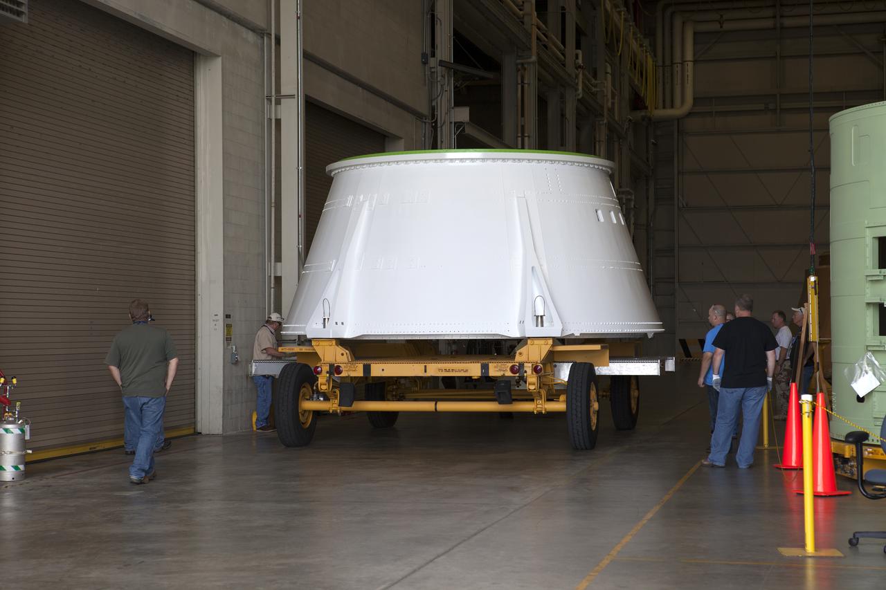 The left hand aft skirt for NASA’s Space Launch System (SLS) rocket is moved inside the Booster Fabrication Facility at the agency’s Kennedy Space Center in Florida. The aft skirt arrived from the Hangar AF facility at Cape Canaveral Air Force Station. The space shuttle-era aft skirt, was inspected, resurfaced, primed and painted for use on the left hand booster of the SLS rocket for Exploration Mission 1 (EM-1). NASA is preparing for EM-1, deep-space missions, and the journey to Mars.