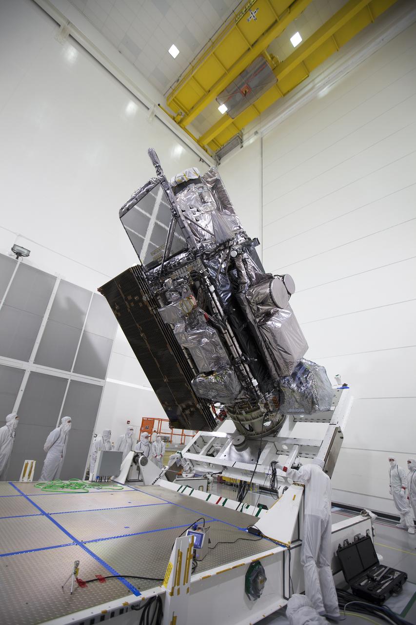The Geostationary Operational Environmental Satellite (GOES-R) is raised to the vertical position on an “up-ender” inside the Astrotech payload processing facility in Titusville, Florida near NASA’s Kennedy Space Center. GOES-R will be the first satellite in a series of next-generation NOAA GOES Satellites. The spacecraft is to launch aboard a United Launch Alliance Atlas V rocket in November.