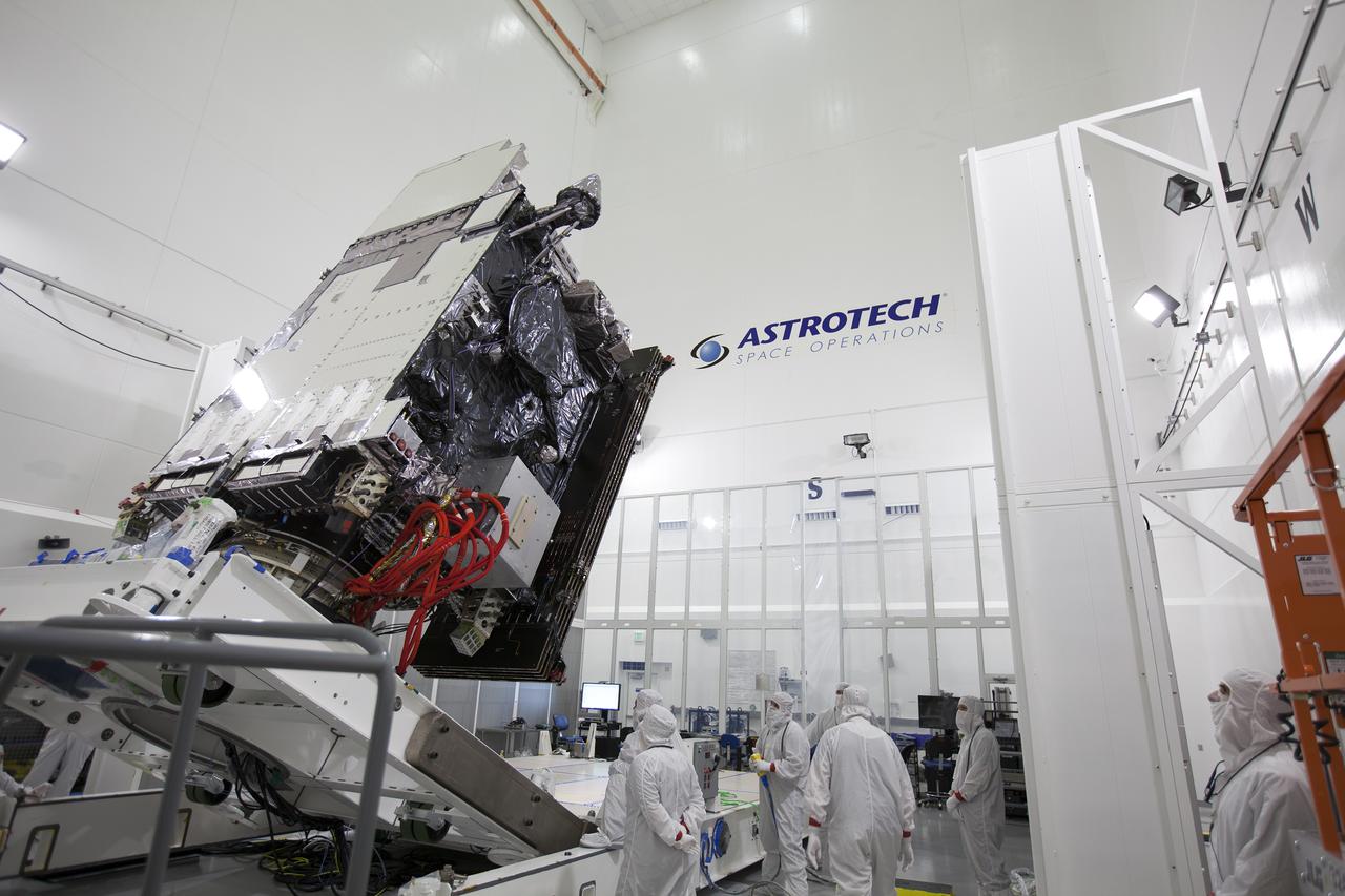 Team members monitor the progress as the Geostationary Operational Environmental Satellite (GOES-R) is lifted to the vertical position on an “up-ender” inside the Astrotech payload processing facility in Titusville, Florida near NASA’s Kennedy Space Center. GOES-R will be the first satellite in a series of next-generation NOAA GOES Satellites. The spacecraft is to launch aboard a United Launch Alliance Atlas V rocket in November.
